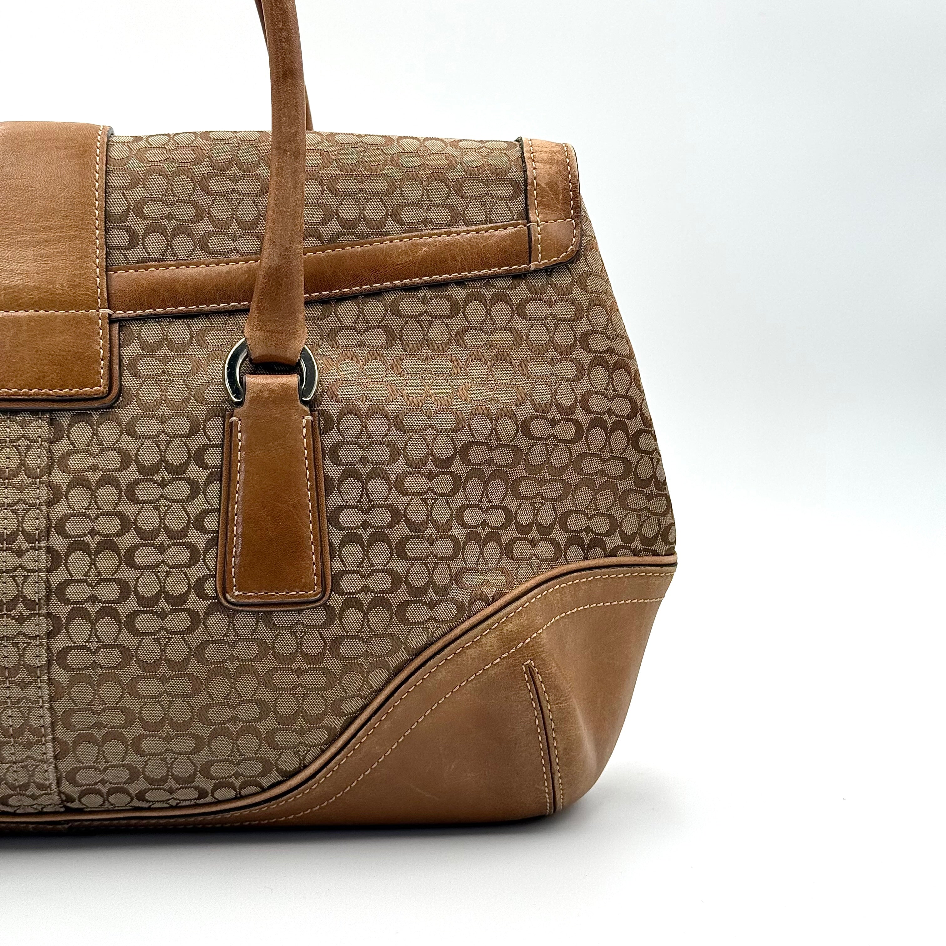Front-facing view of the Coach Y2K Signature Soho Shoulder Bag in beige and tan jacquard with leather trim.
