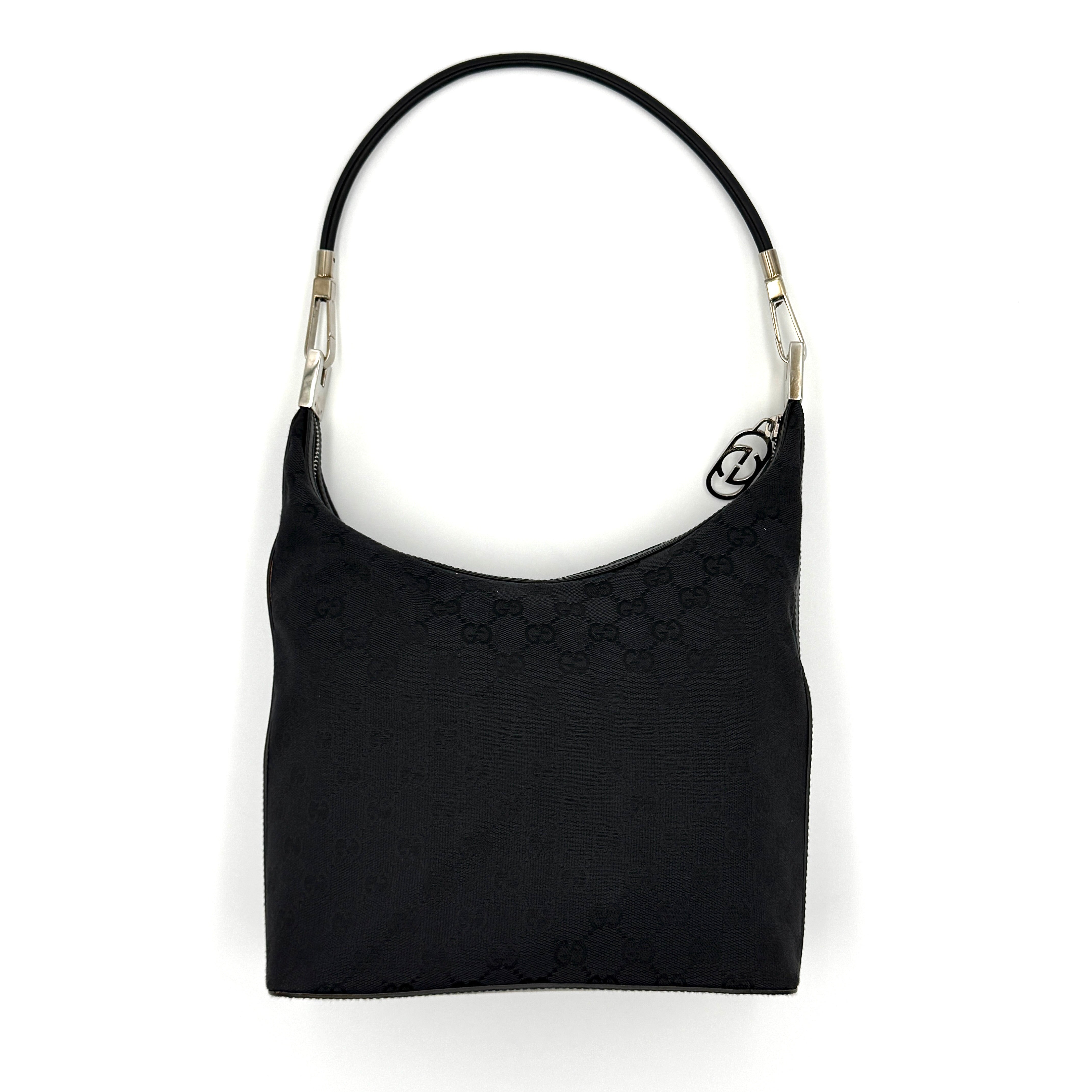 Gucci GG Monogram Hobo Shoulder Bag in black canvas with tonal GG logo pattern, silver-tone hardware and a single top handle.