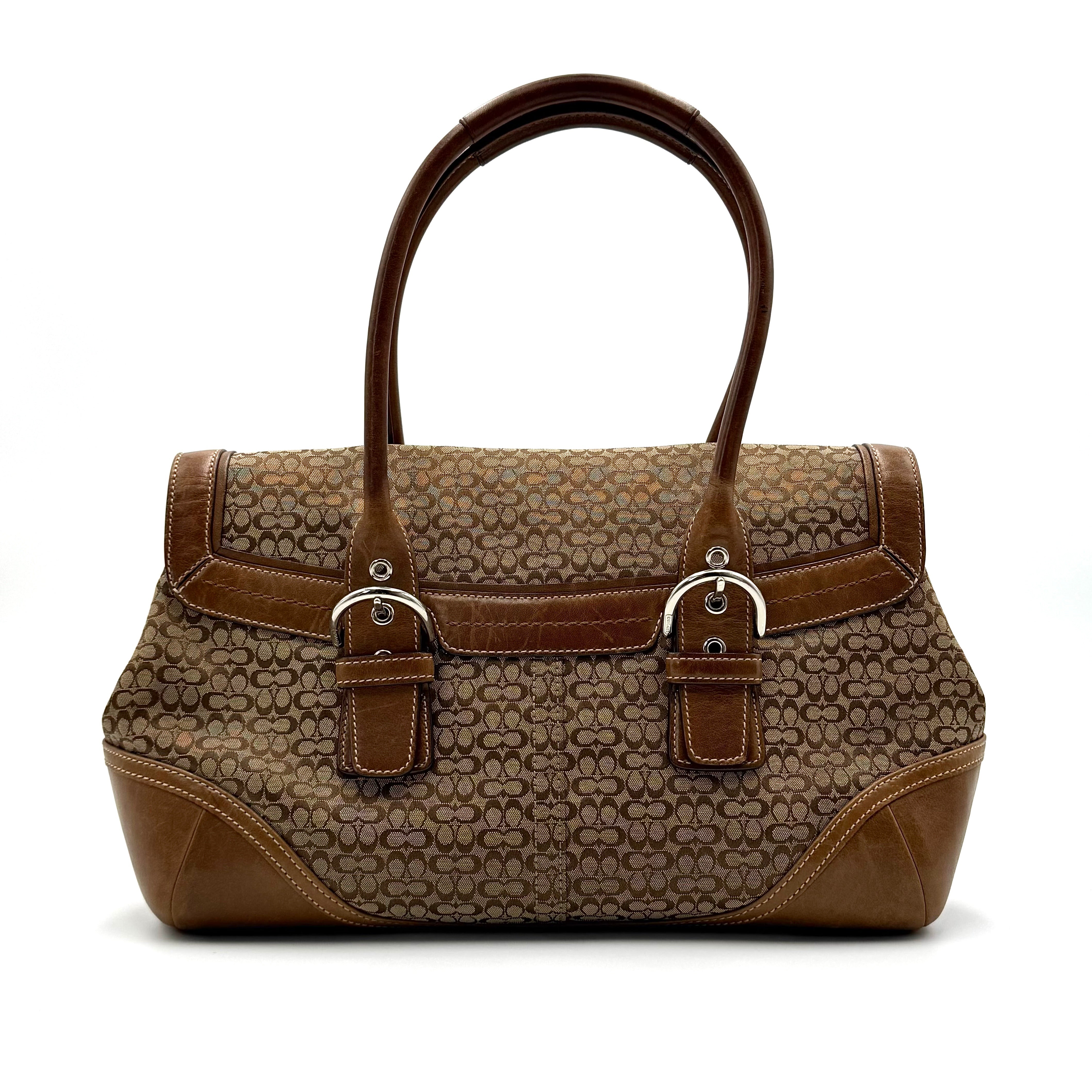 Coach Soho Hampton satchel in beige jacquard canvas with tan leather trim and rolled handles shown against a white background.