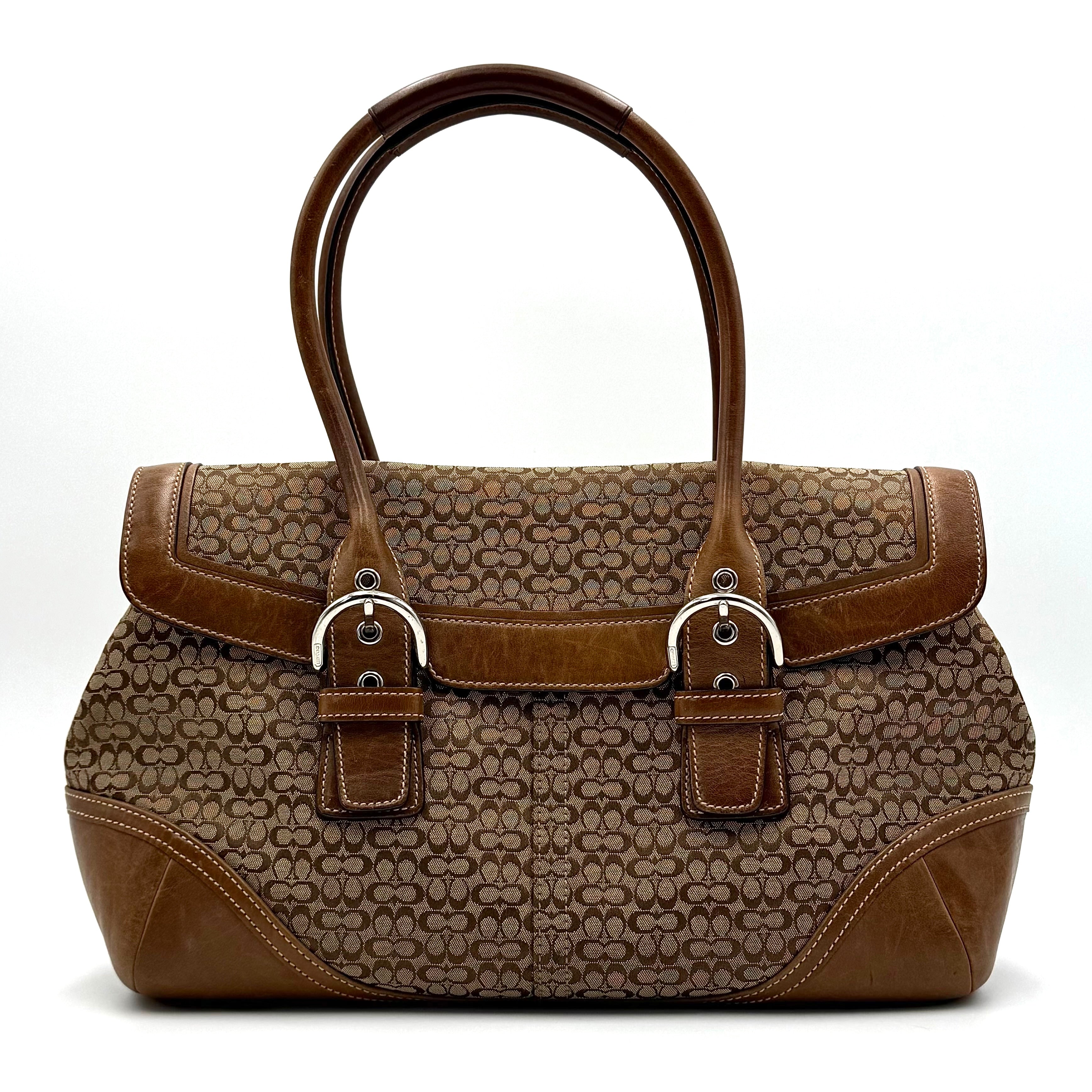 Coach Soho Hampton satchel in beige jacquard canvas with tan leather trim and rolled handles shown against a white background.