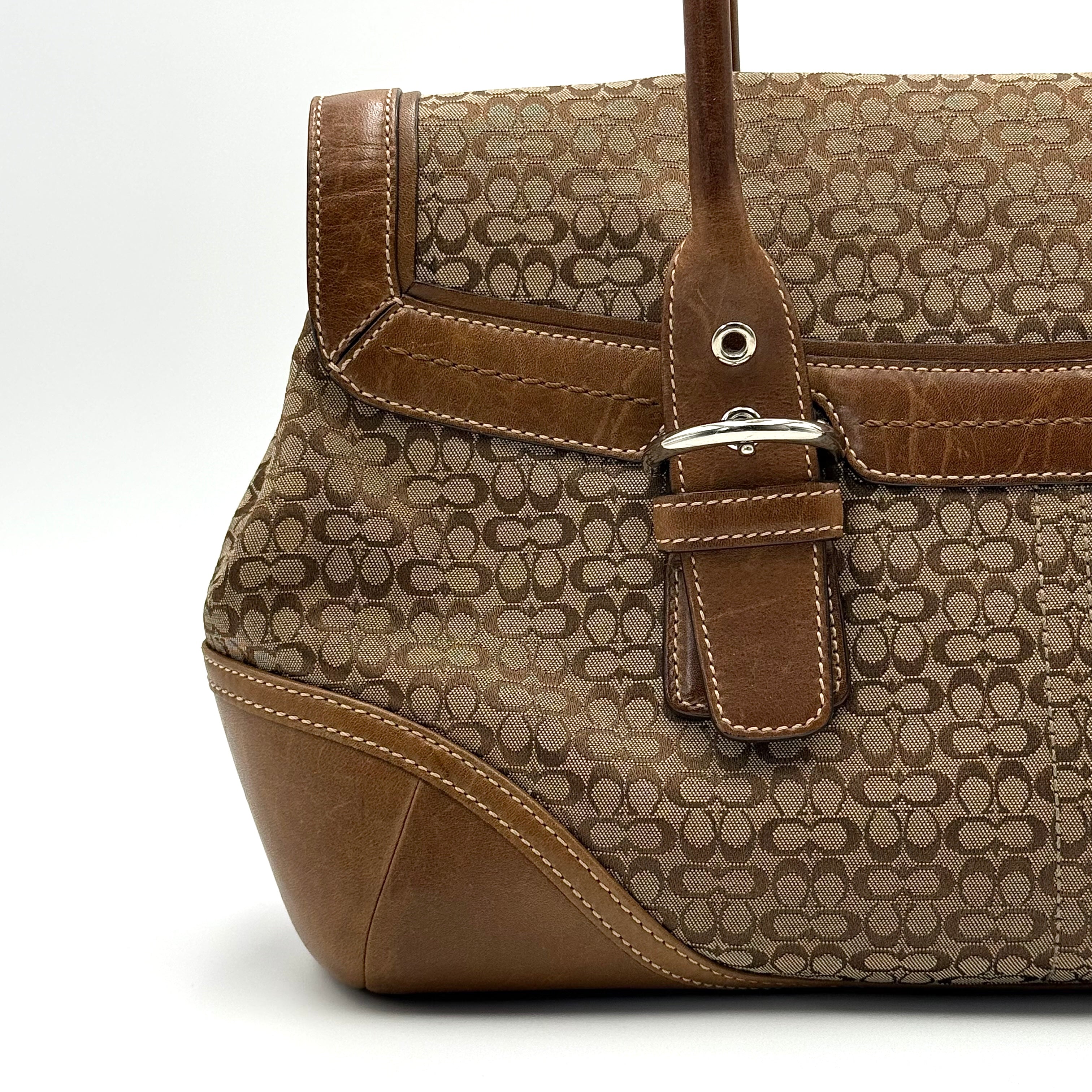 Coach Soho Hampton satchel in beige jacquard canvas with tan leather trim and rolled handles shown against a white background.