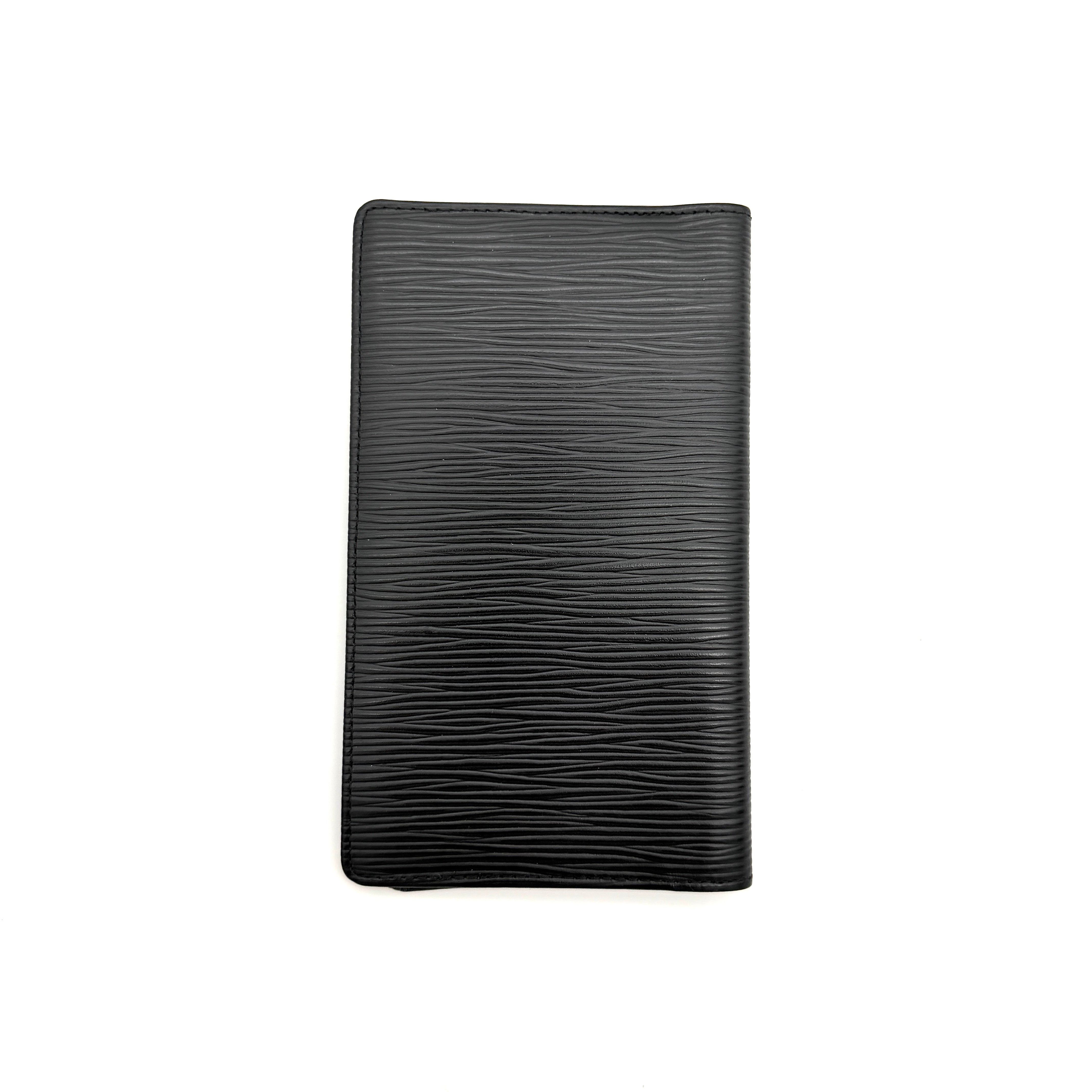 Black Louis Vuitton Epi Leather Brazza Wallet with a textured finish against a white background.