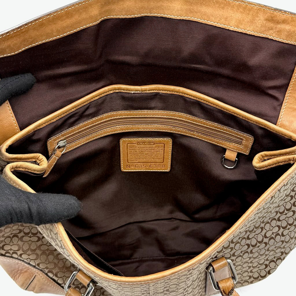 Coach Signature Soho shoulder bag in beige and tan canvas with leather trim and silver buckle.