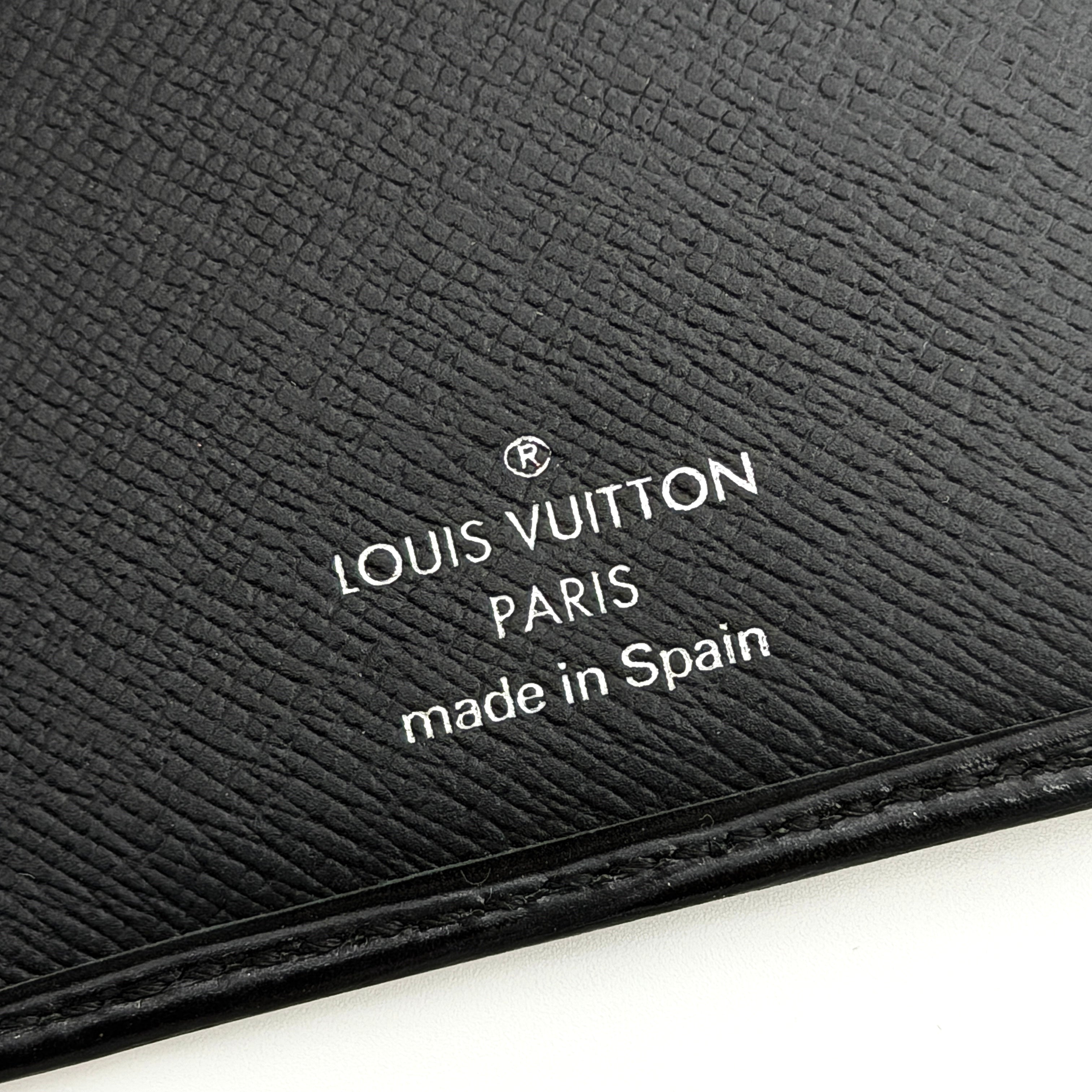 Black Louis Vuitton Epi Leather Brazza Wallet with a textured finish against a white background.