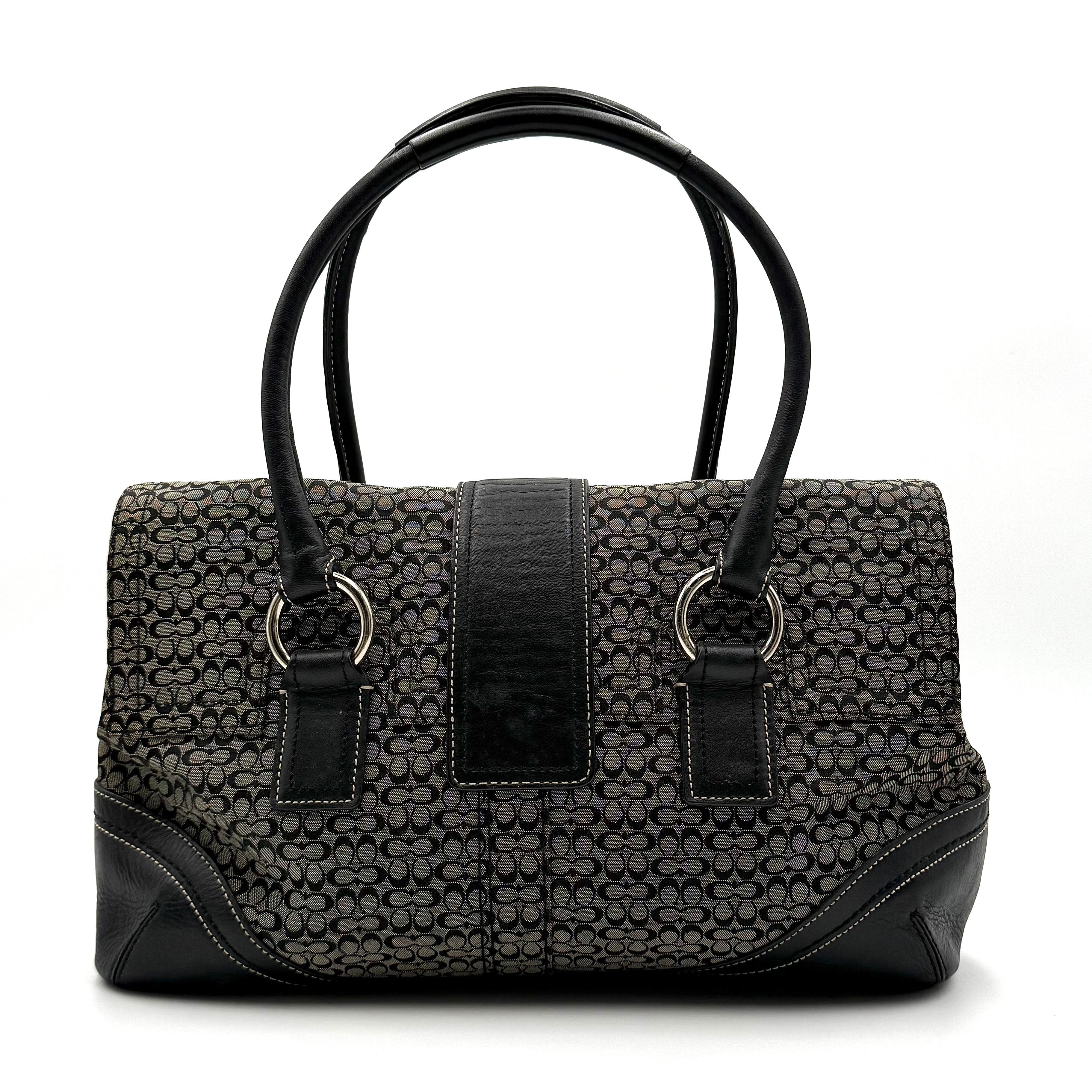 Coach Soho shoulder bag in grey and black jacquard with leather trim and silver hardware, presented with double top handles.