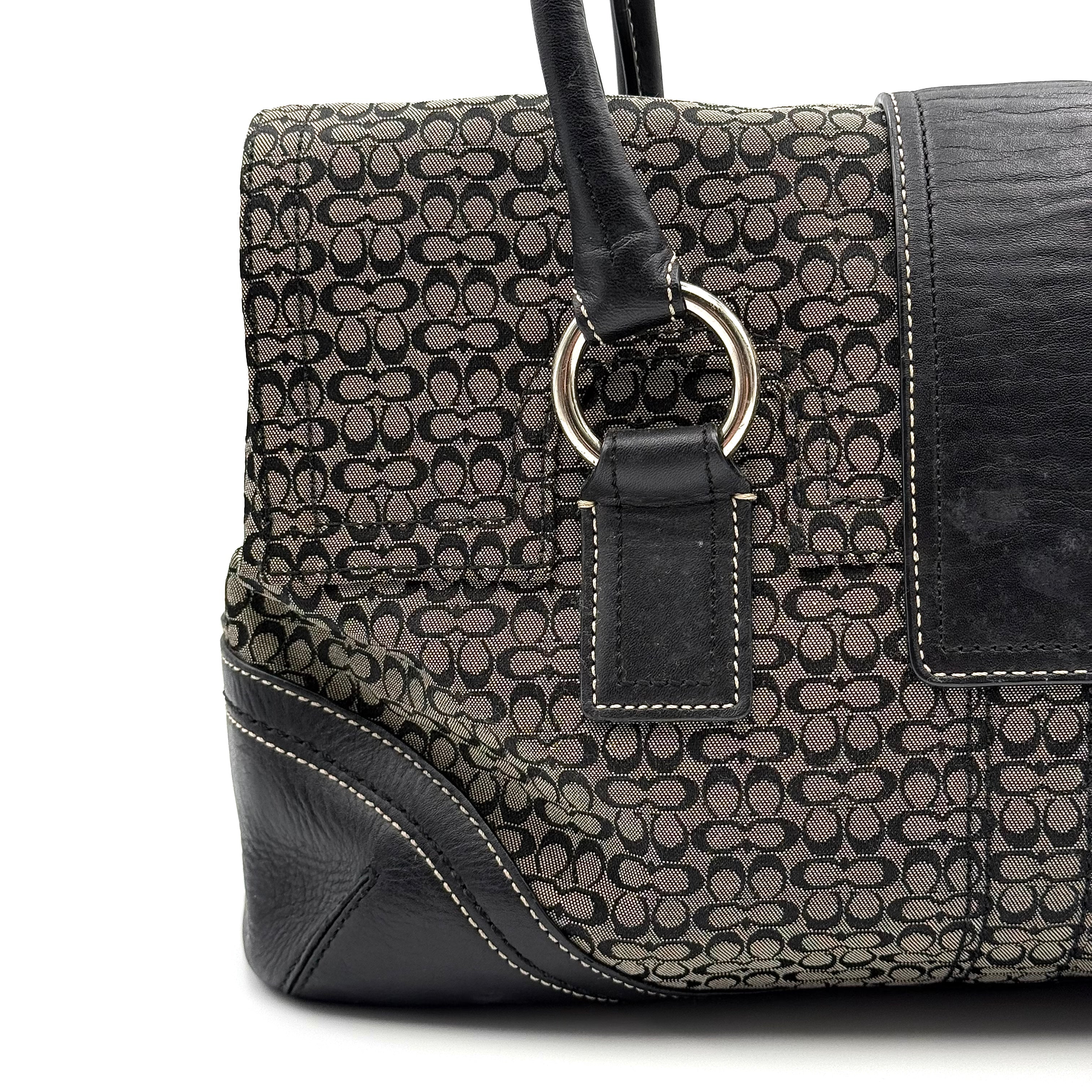 Coach Soho shoulder bag in grey and black jacquard with leather trim and silver hardware, presented with double top handles.