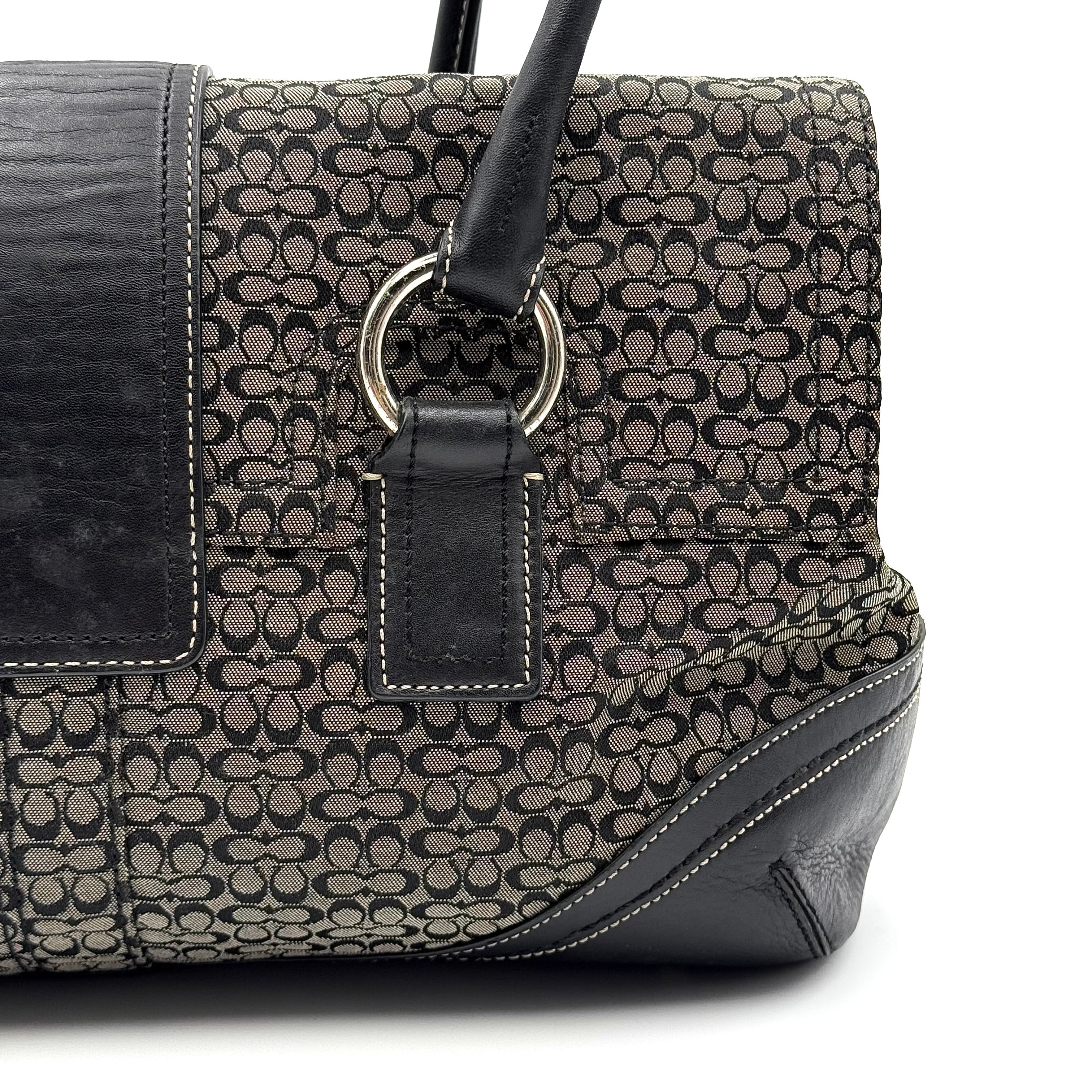 Coach Soho shoulder bag in grey and black jacquard with leather trim and silver hardware, presented with double top handles.