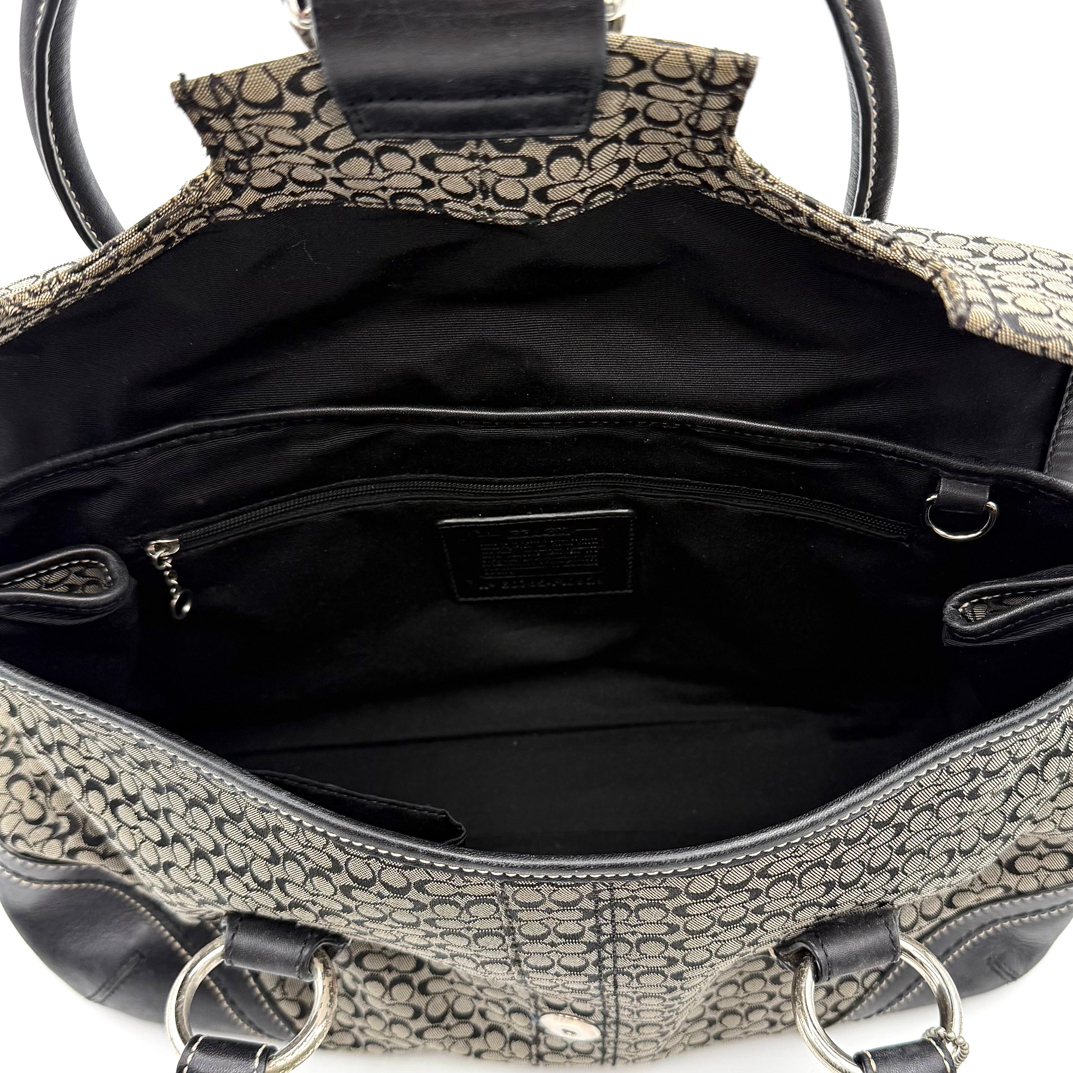 Coach Soho shoulder bag in grey and black jacquard with leather trim and silver hardware, presented with double top handles.