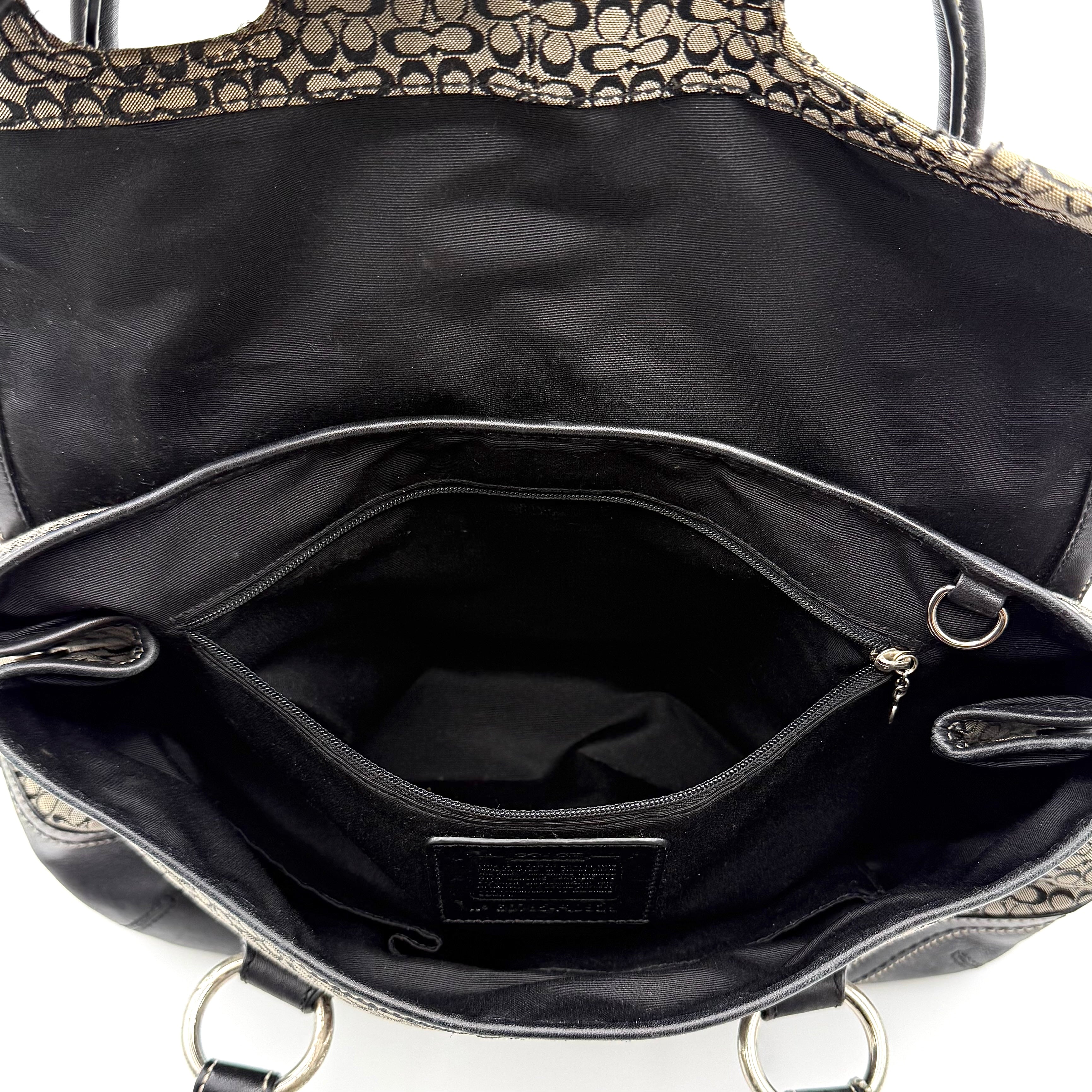 Coach Soho shoulder bag in grey and black jacquard with leather trim and silver hardware, presented with double top handles.