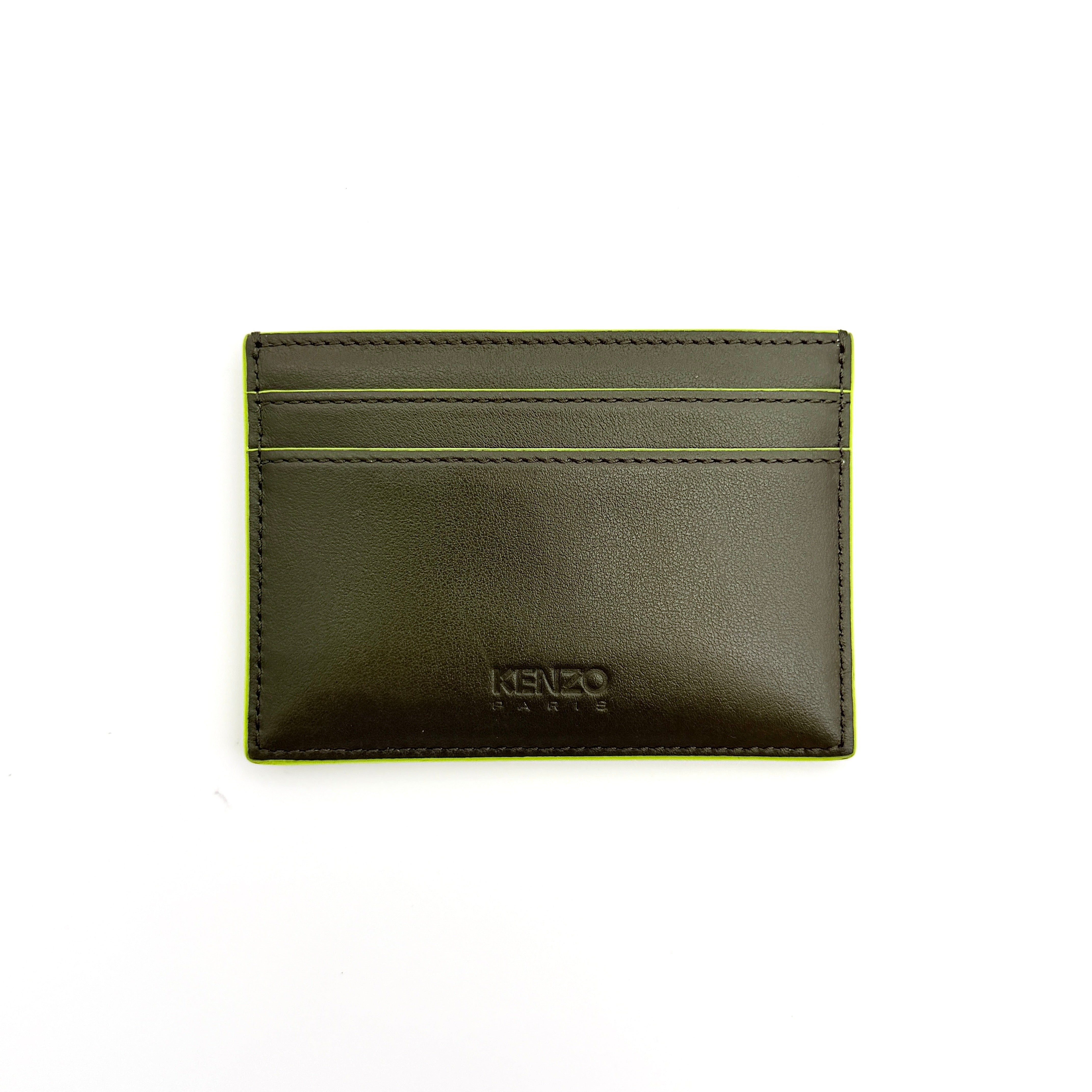 Kenzo Paris green leather card holder with embossed logo and neon yellow edging, shown with Kenzo Paris cards.