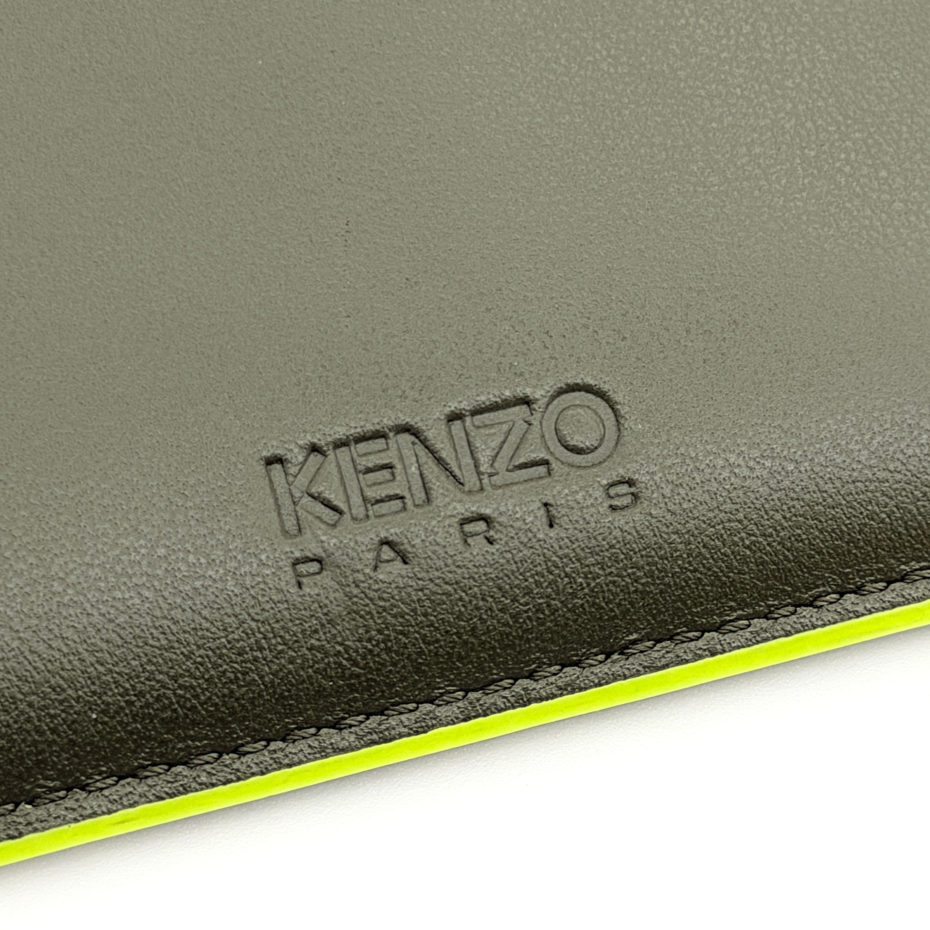Kenzo Paris green leather card holder with embossed logo and neon yellow edging, shown with Kenzo Paris cards.