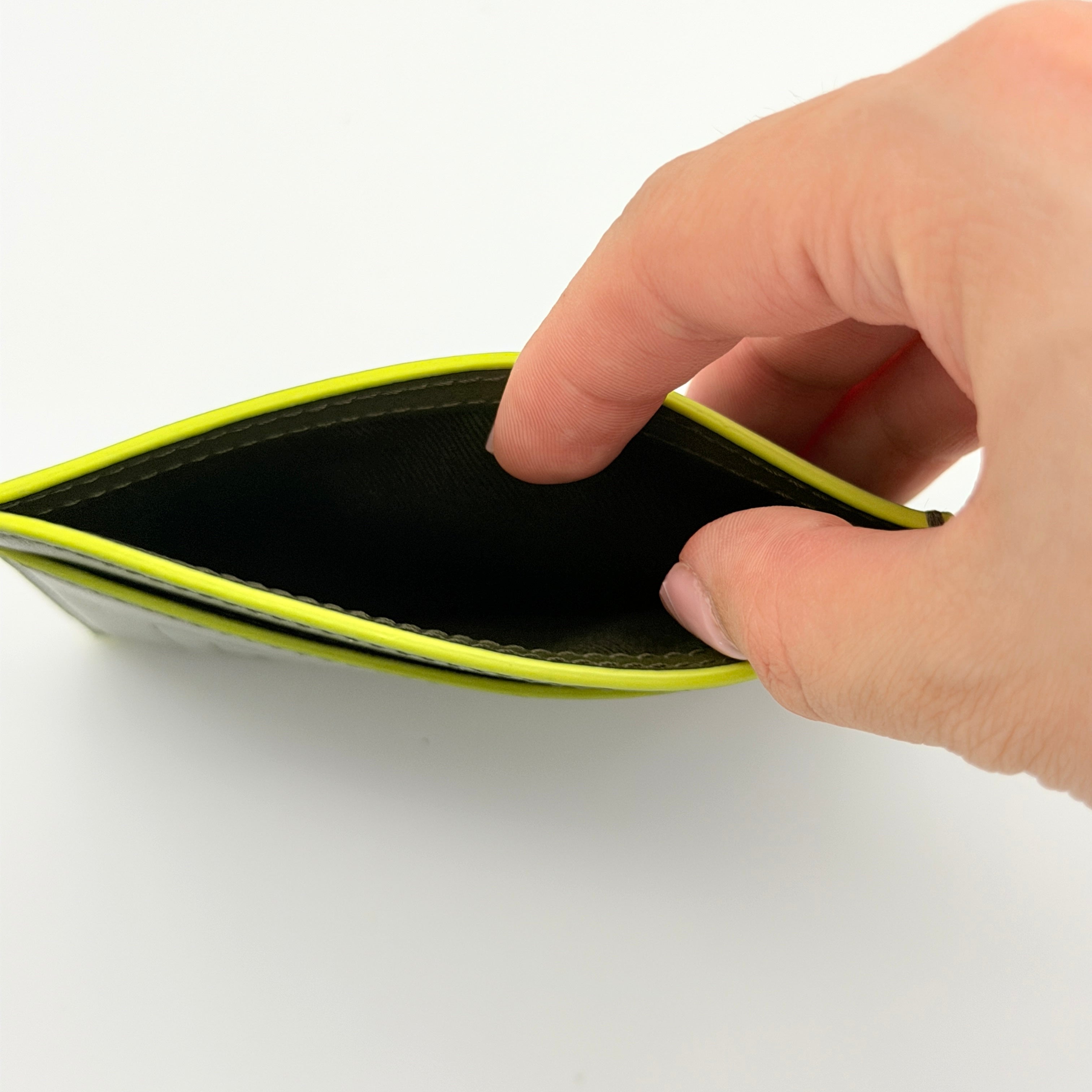 Kenzo Paris green leather card holder with embossed logo and neon yellow edging, shown with Kenzo Paris cards.