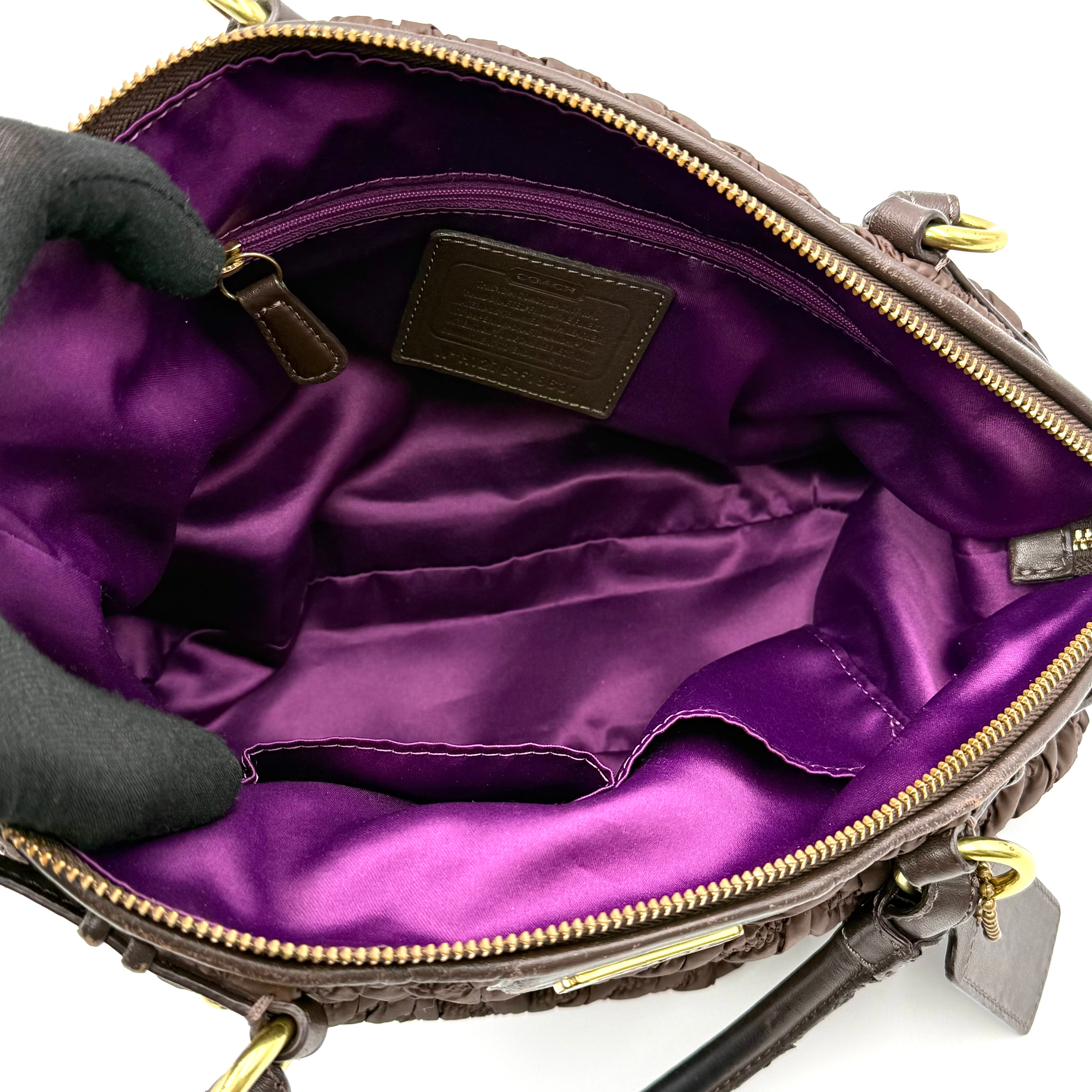 Front view of the Coach Madison Chevron 2Way brown quilted nylon shoulder bag with rolled leather handles and gold-tone hardware.