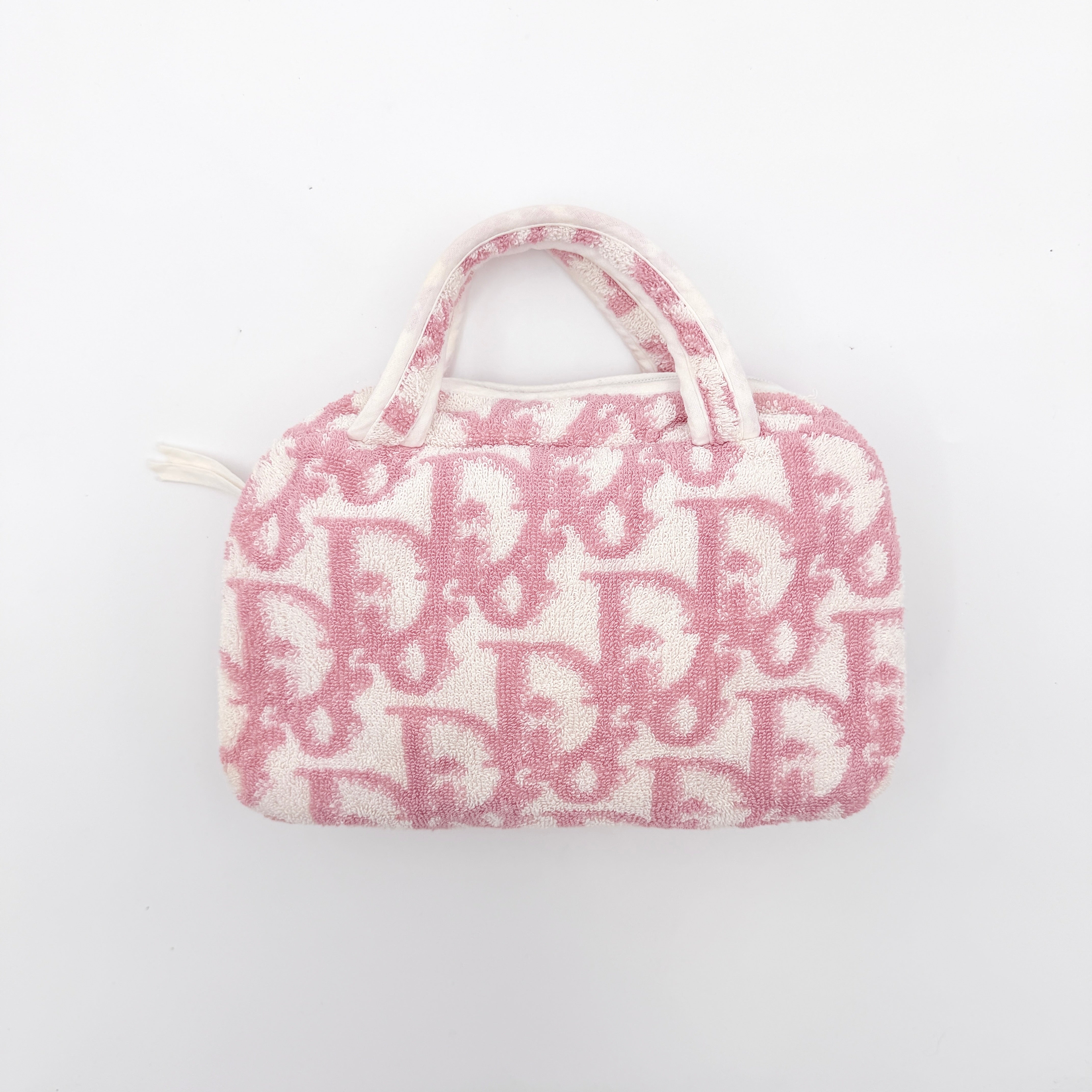 Christian Dior pink and white Trotter terry cloth mini bag with top handles and zip closure, displayed on a white background.