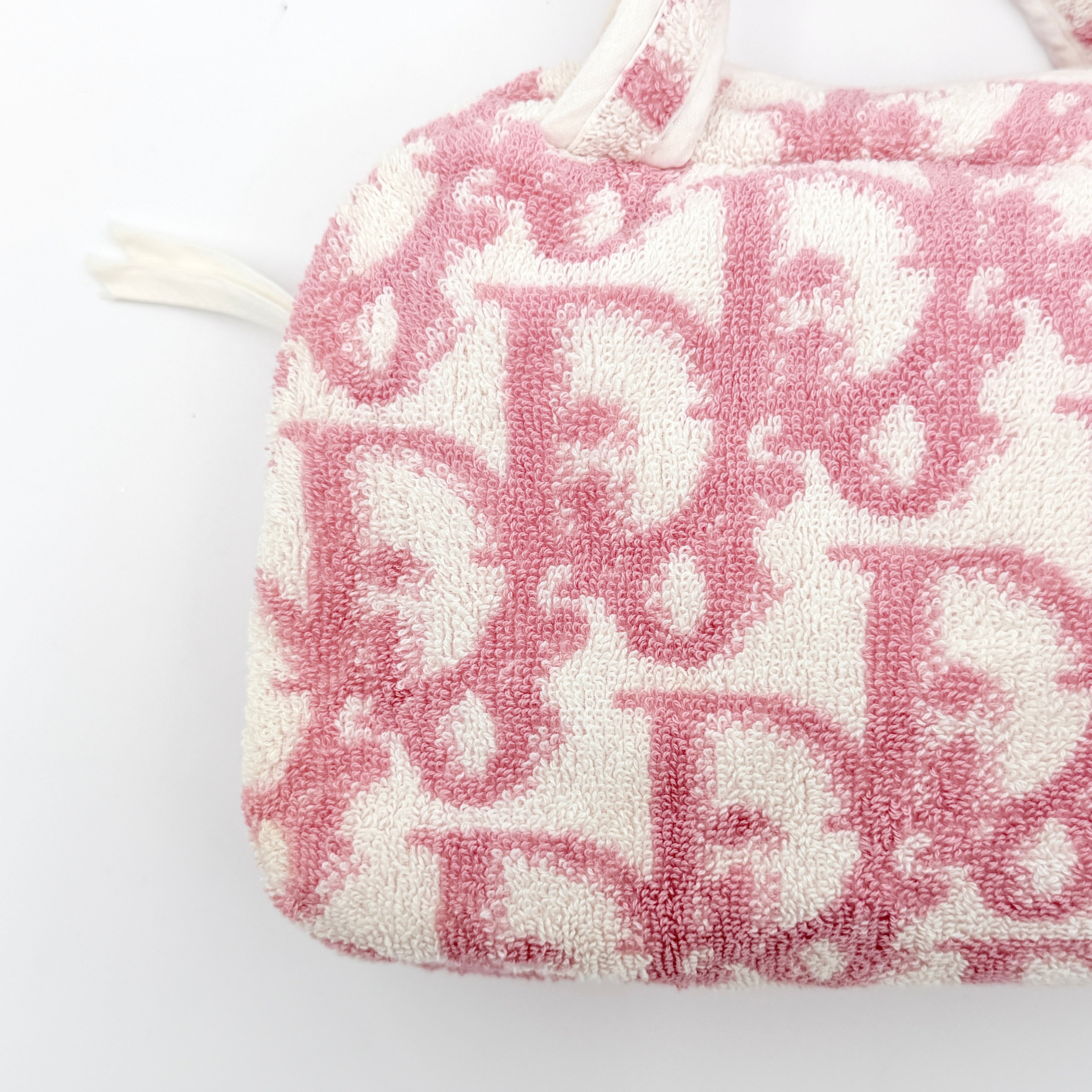 Christian Dior pink and white Trotter terry cloth mini bag with top handles and zip closure, displayed on a white background.