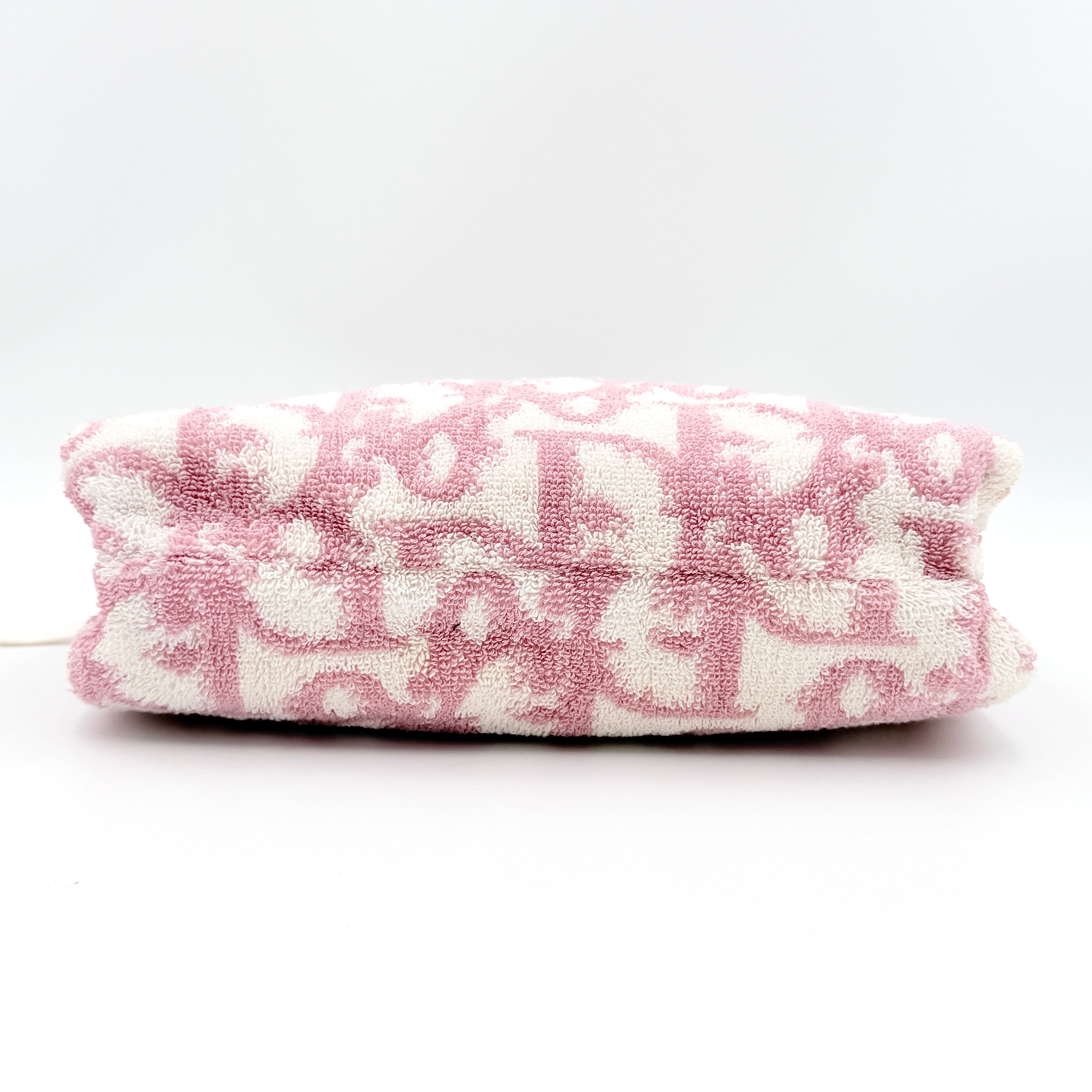 Christian Dior pink and white Trotter terry cloth mini bag with top handles and zip closure, displayed on a white background.