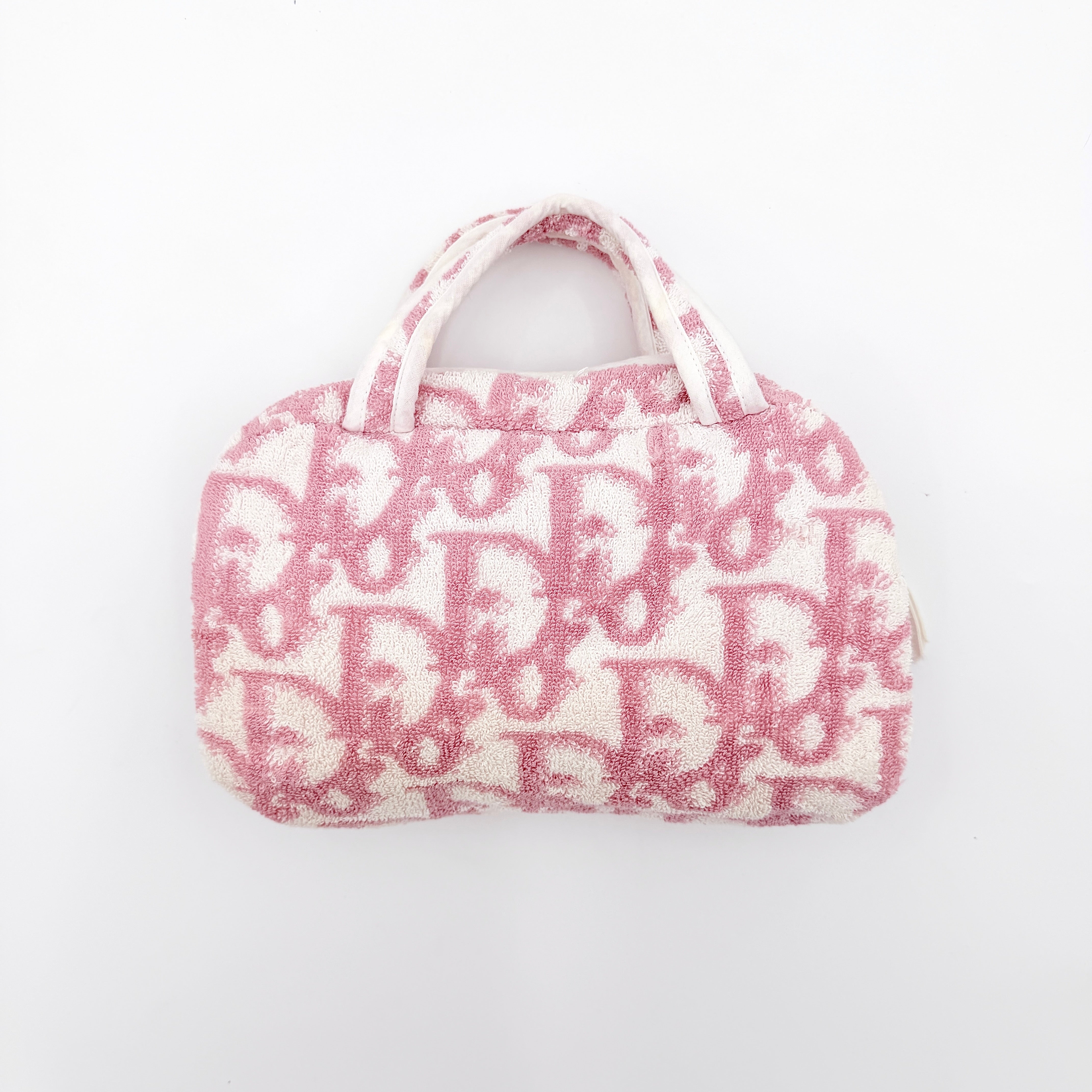Christian Dior pink and white Trotter terry cloth mini bag with top handles and zip closure, displayed on a white background.