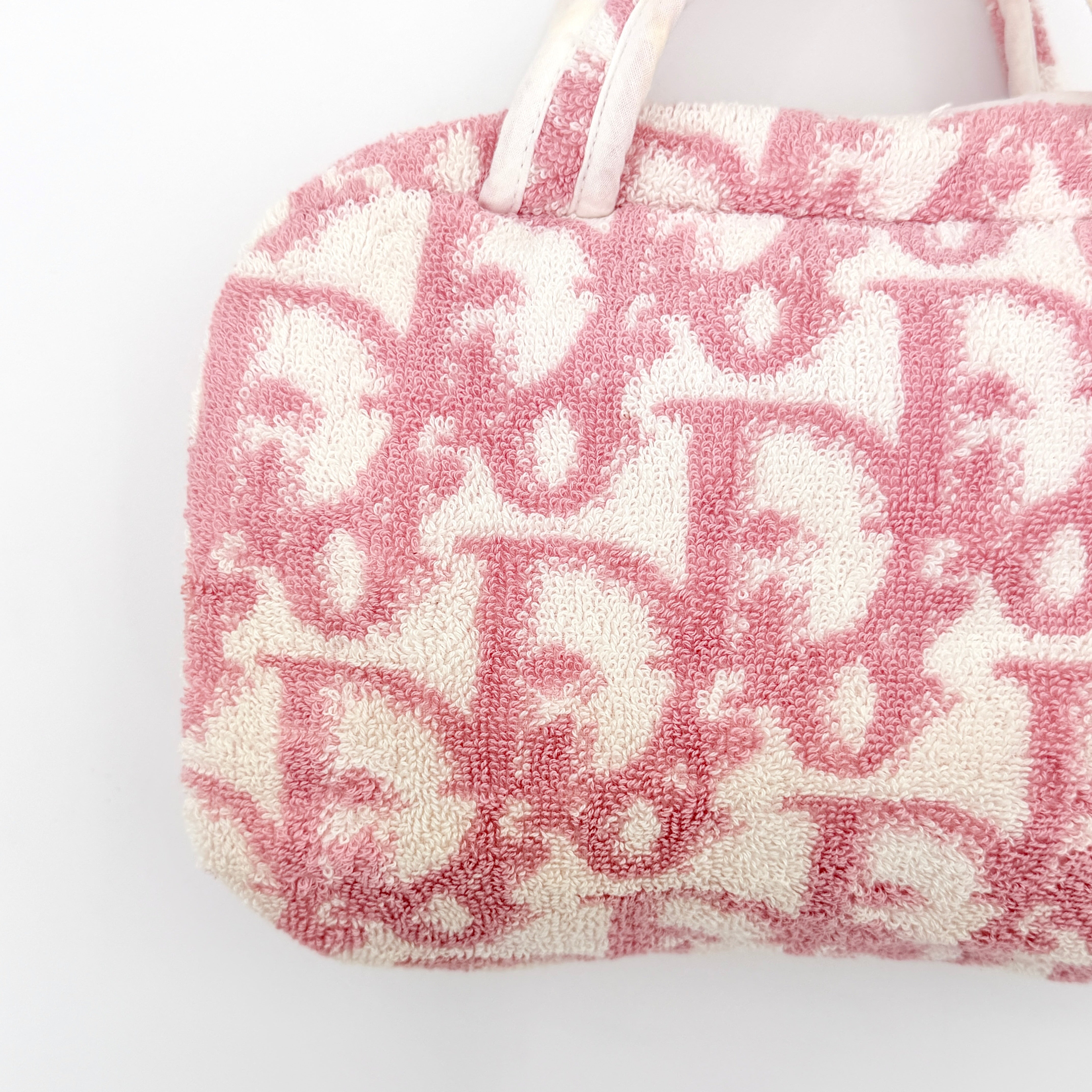 Christian Dior pink and white Trotter terry cloth mini bag with top handles and zip closure, displayed on a white background.