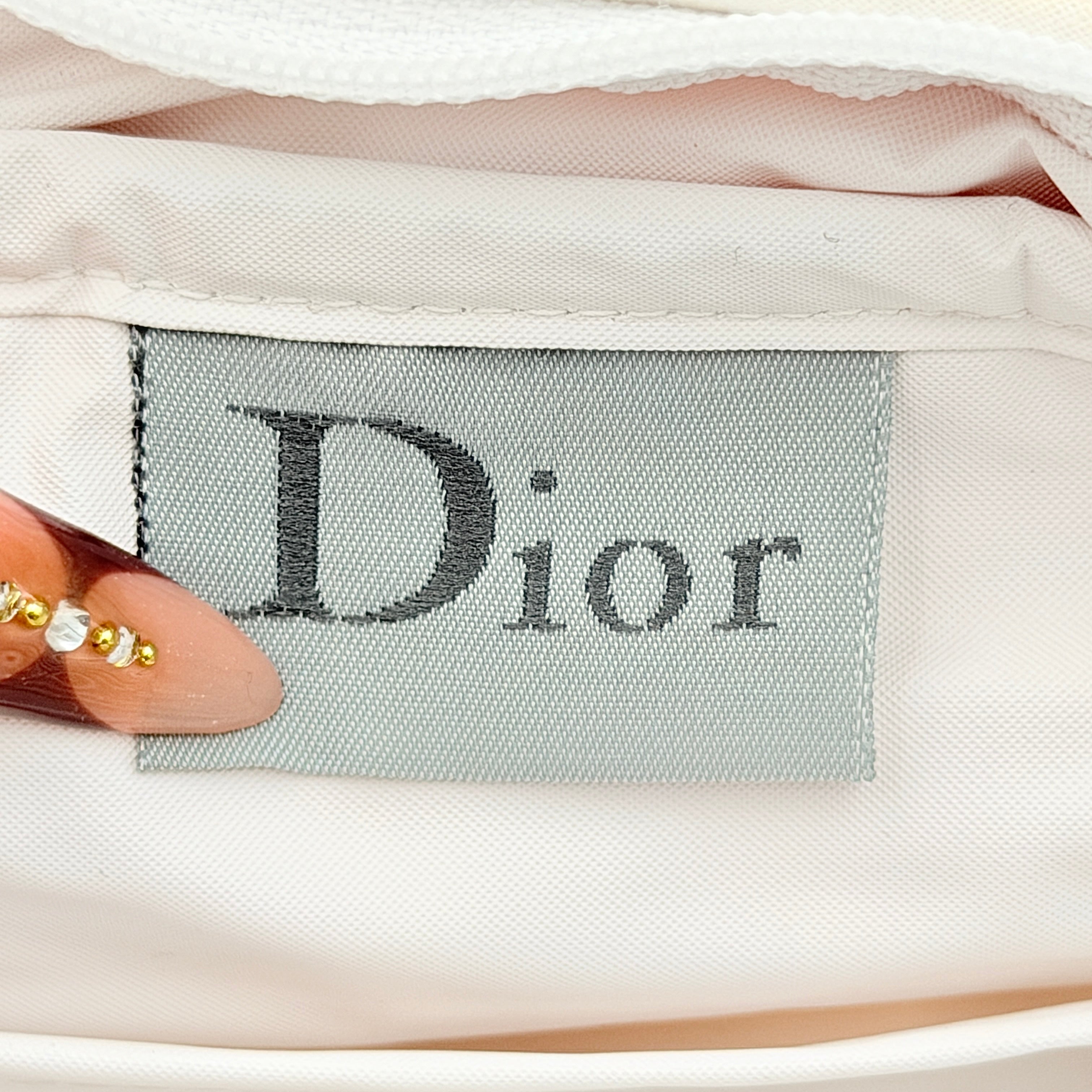 Christian Dior pink and white Trotter terry cloth mini bag with top handles and zip closure, displayed on a white background.