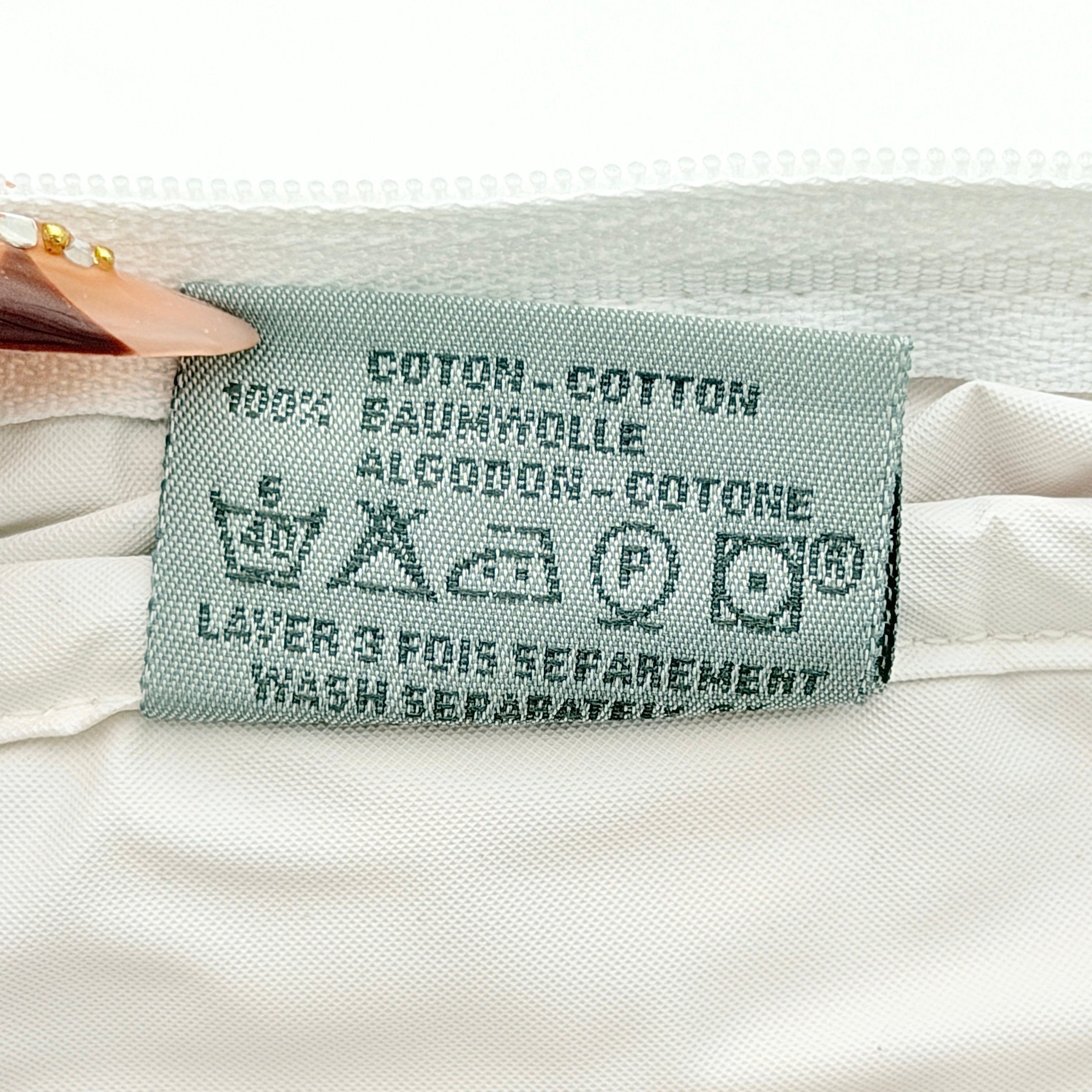 Christian Dior pink and white Trotter terry cloth mini bag with top handles and zip closure, displayed on a white background.