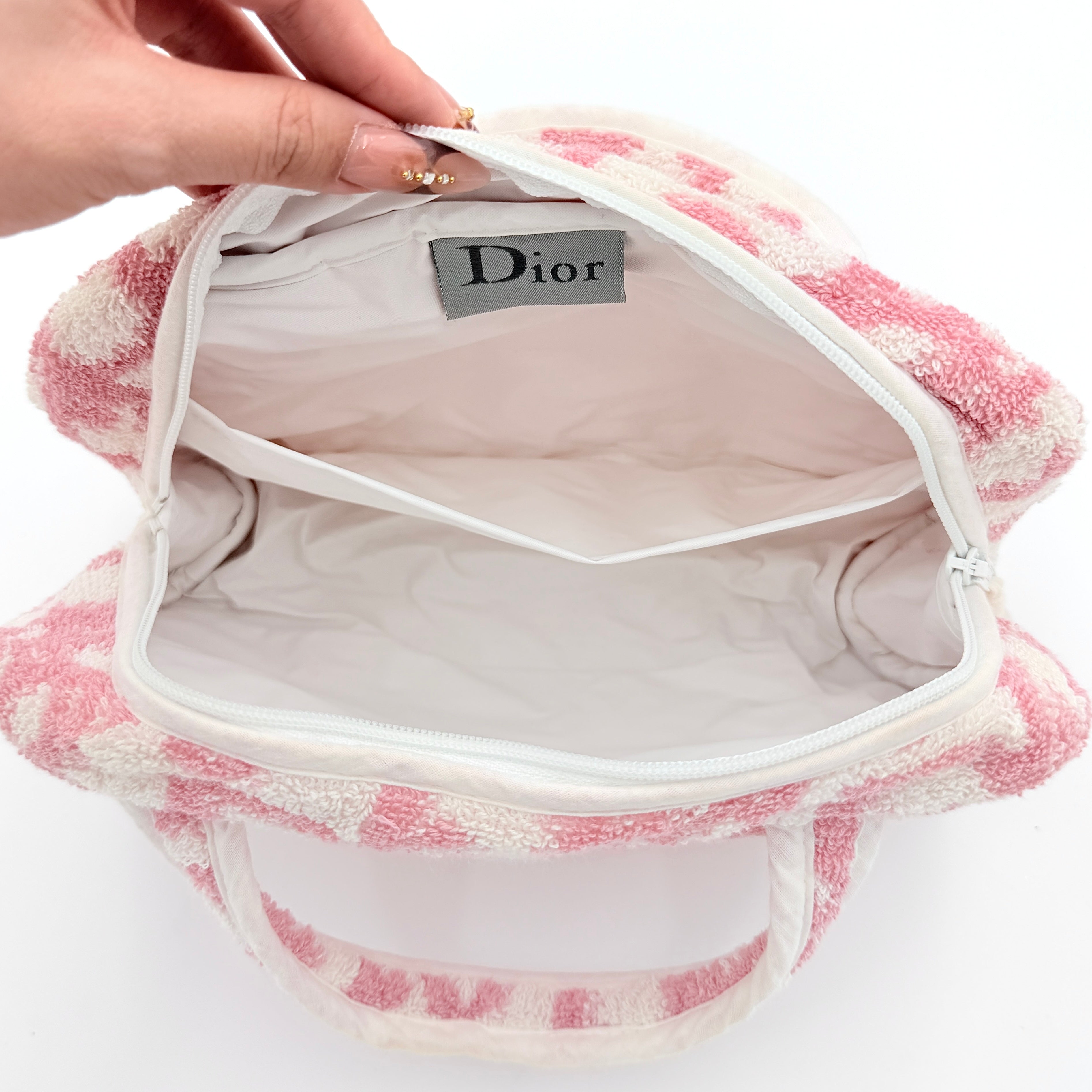 Christian Dior pink and white Trotter terry cloth mini bag with top handles and zip closure, displayed on a white background.