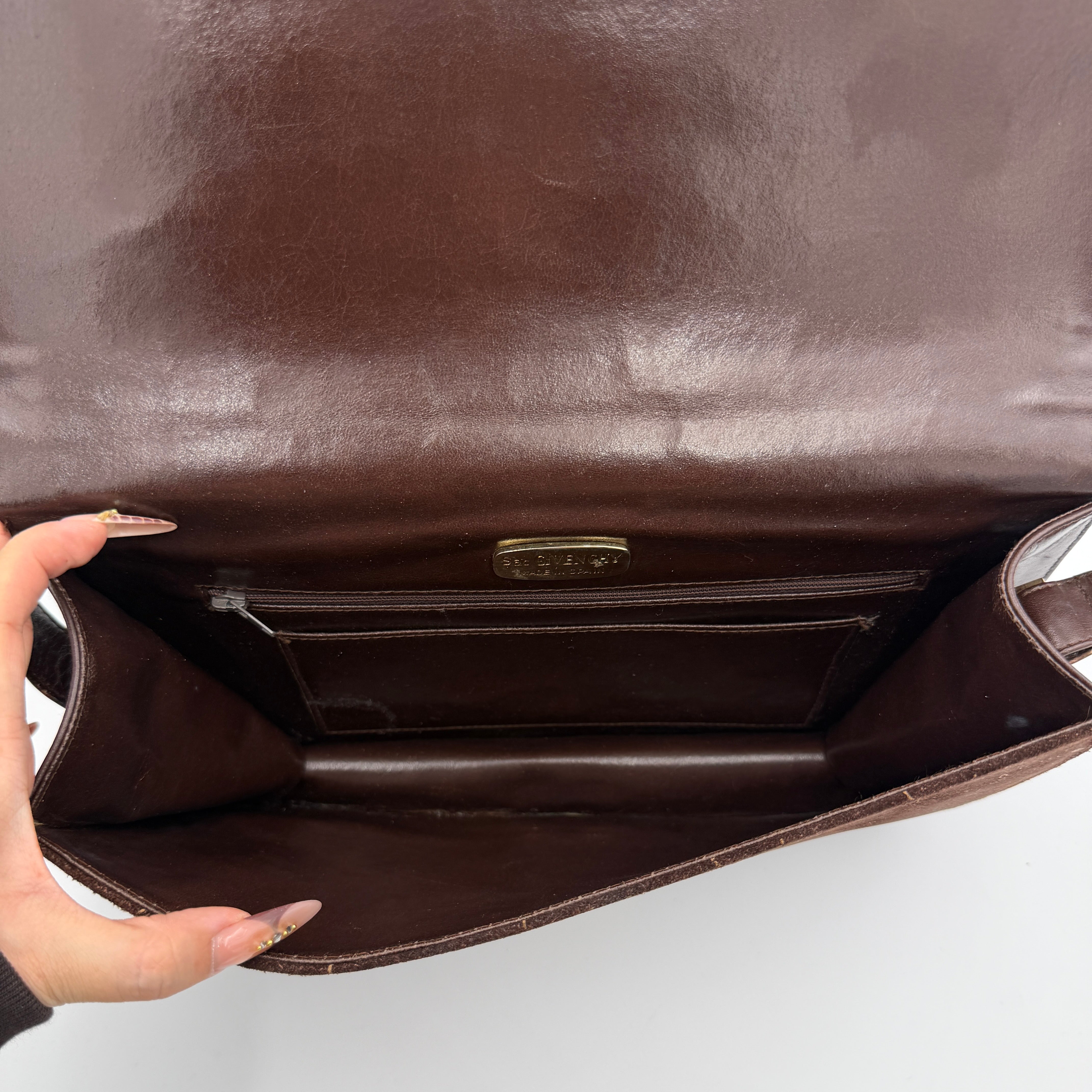 Givenchy 4G Monogram brown suede shoulder bag with leather trim and silver-tone clasp, photographed on a white background.