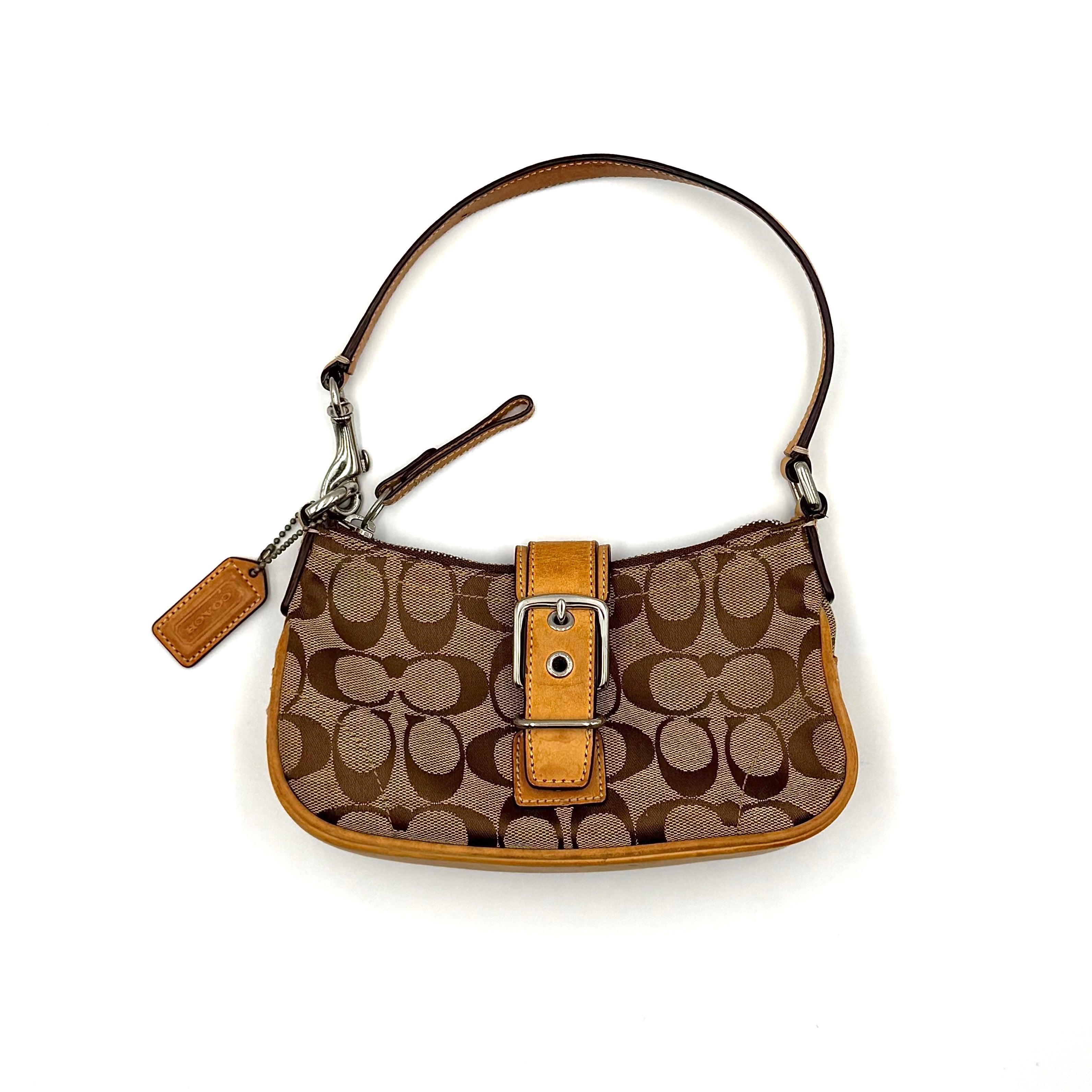 Coach Soho Demi shoulder bag in beige and tan monogram canvas with leather trim and buckle detail.