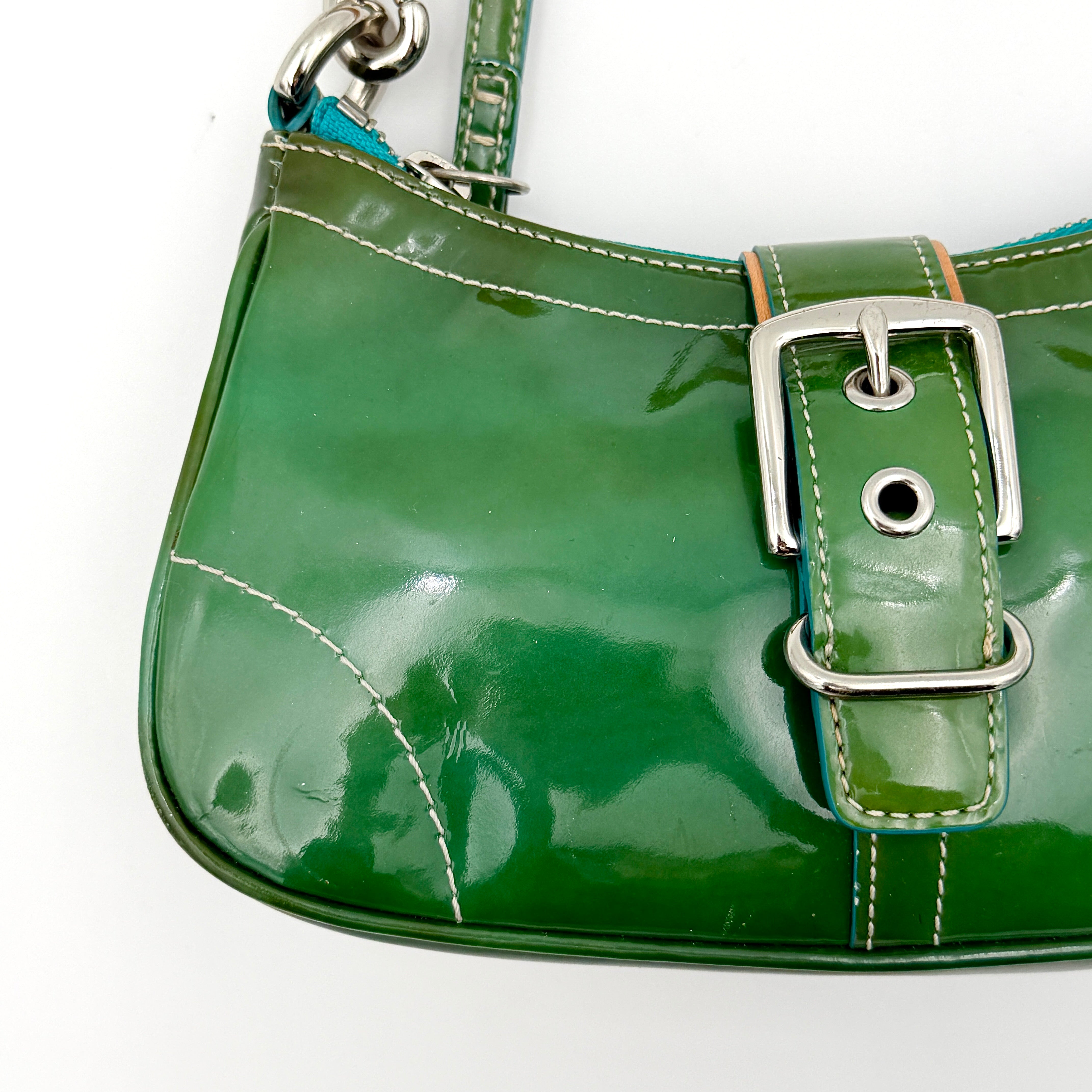 Coach Y2K Demi Soho shoulder bag in glossy green patent leather with silver hardware and natural leather strap.