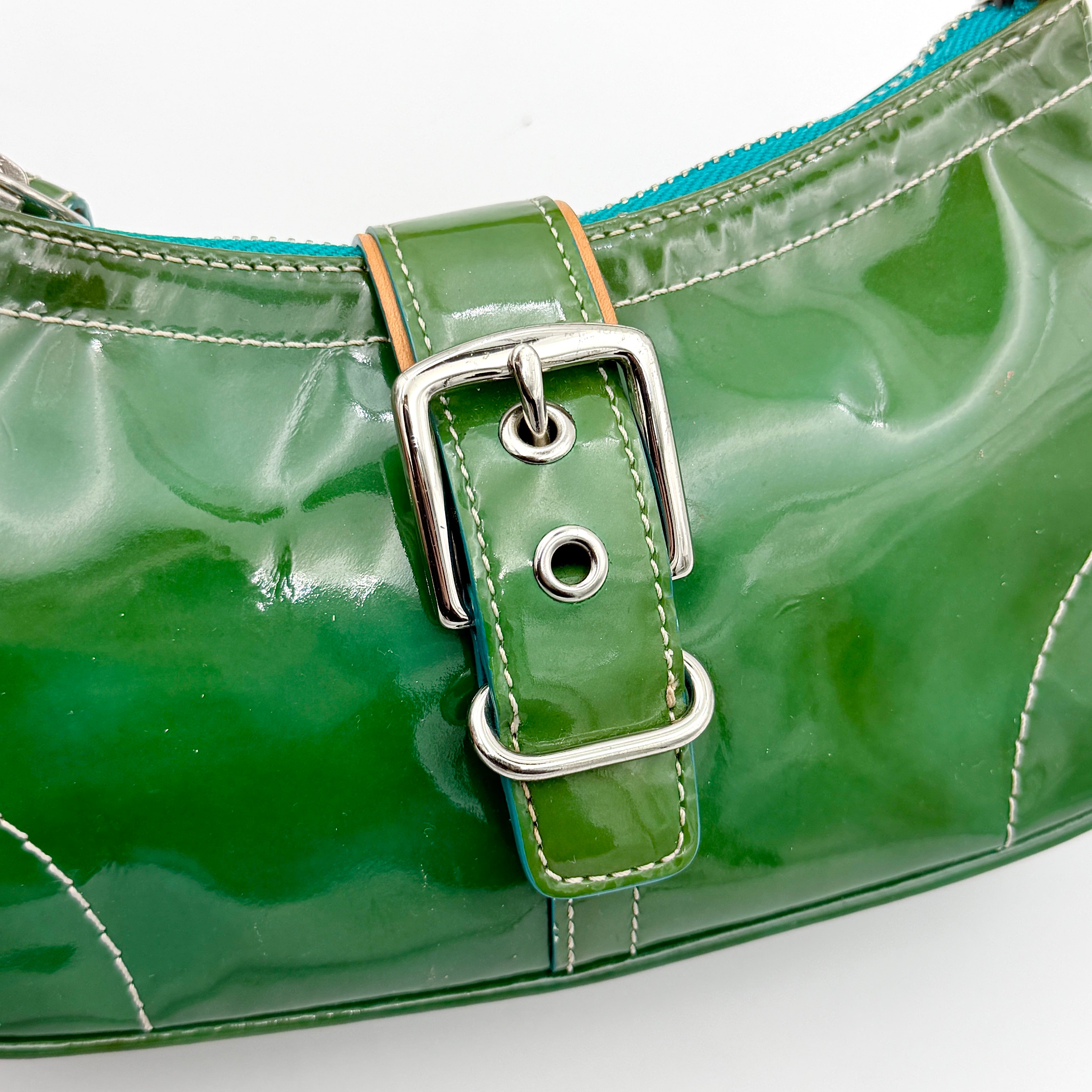 Coach Y2K Demi Soho shoulder bag in glossy green patent leather with silver hardware and natural leather strap.