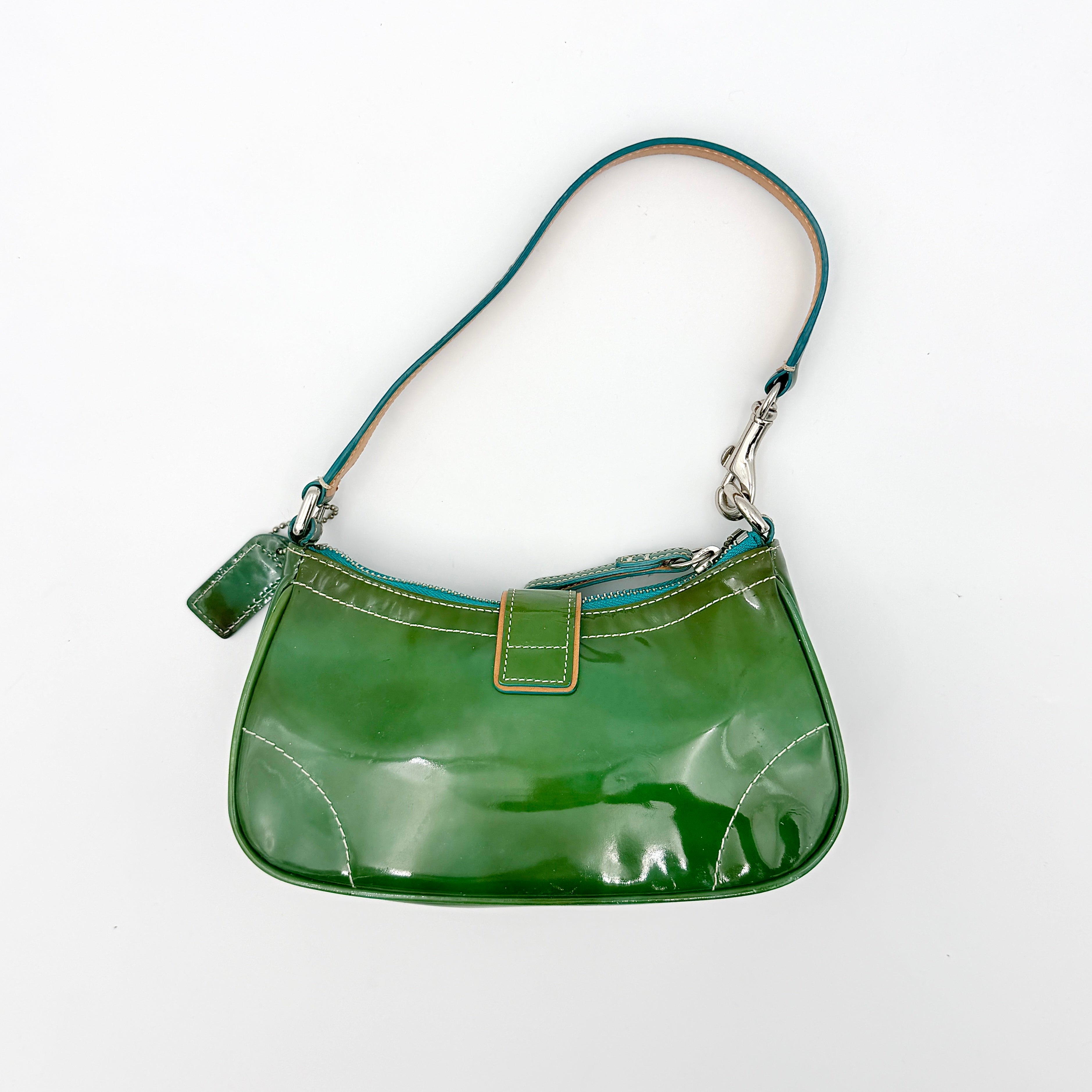 Coach Y2K Demi Soho shoulder bag in glossy green patent leather with silver hardware and natural leather strap.