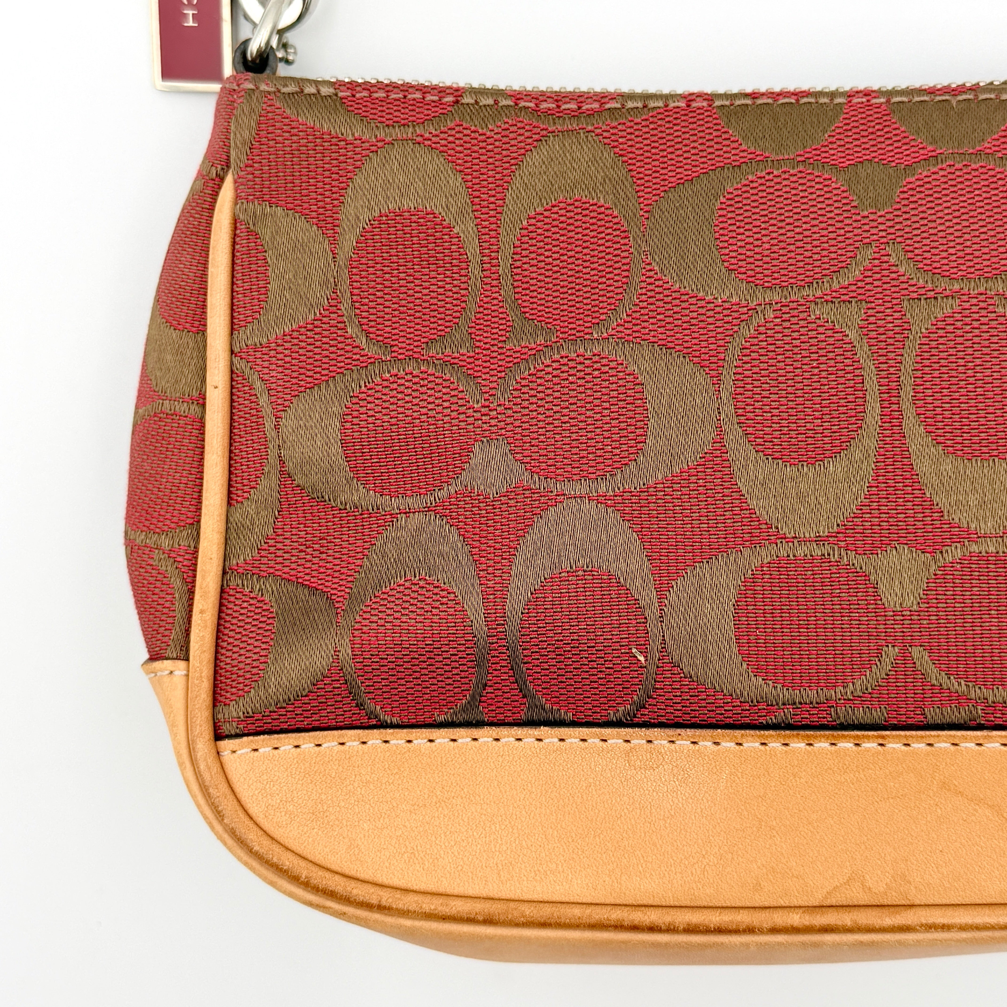 Coach Y2K Demi Shoulder Bag in red and tan signature monogram with leather trim, shown with leather strap and Coach tag.
