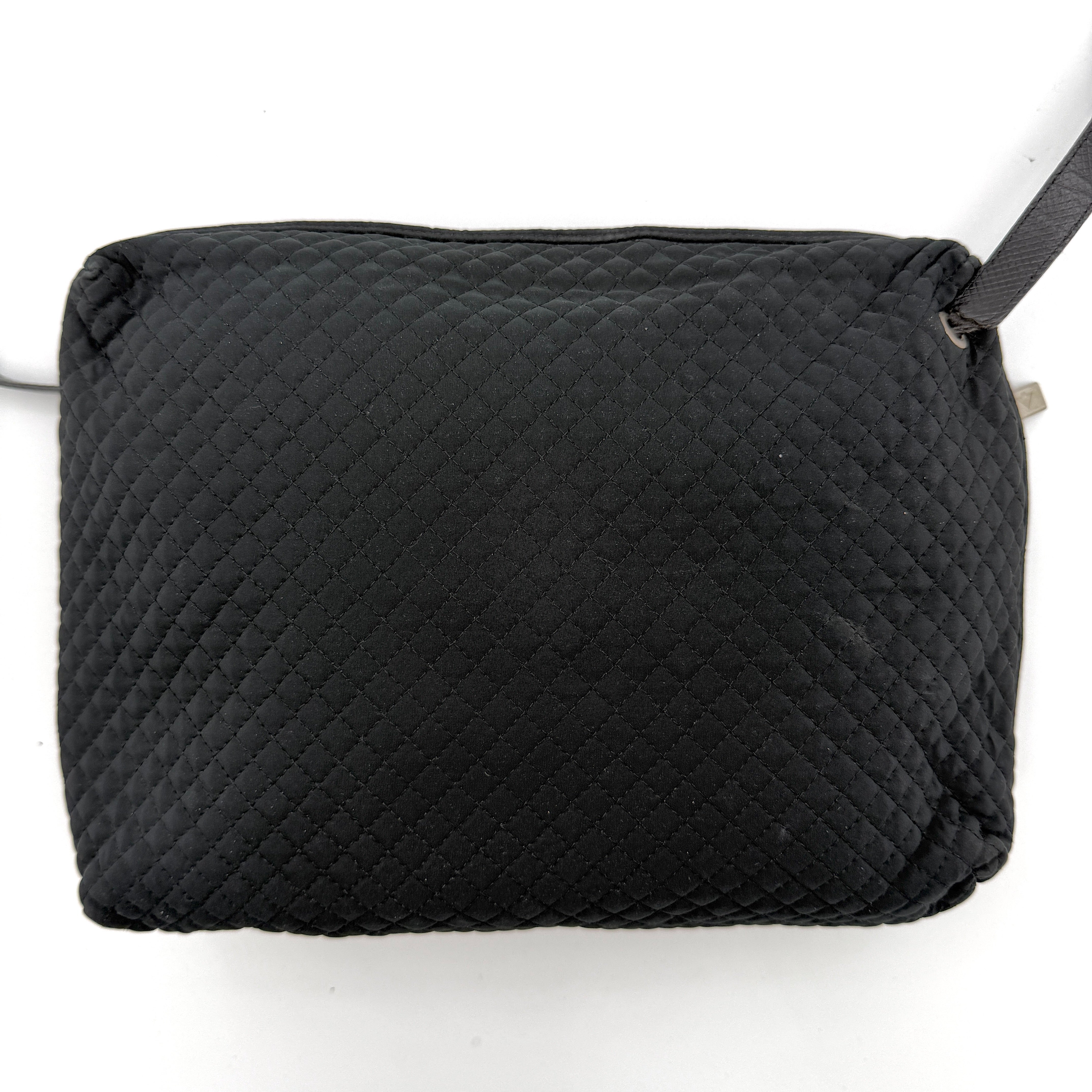 Bottega Veneta black quilted nylon crossbody bag with silver-tone logo hardware and leather strap.