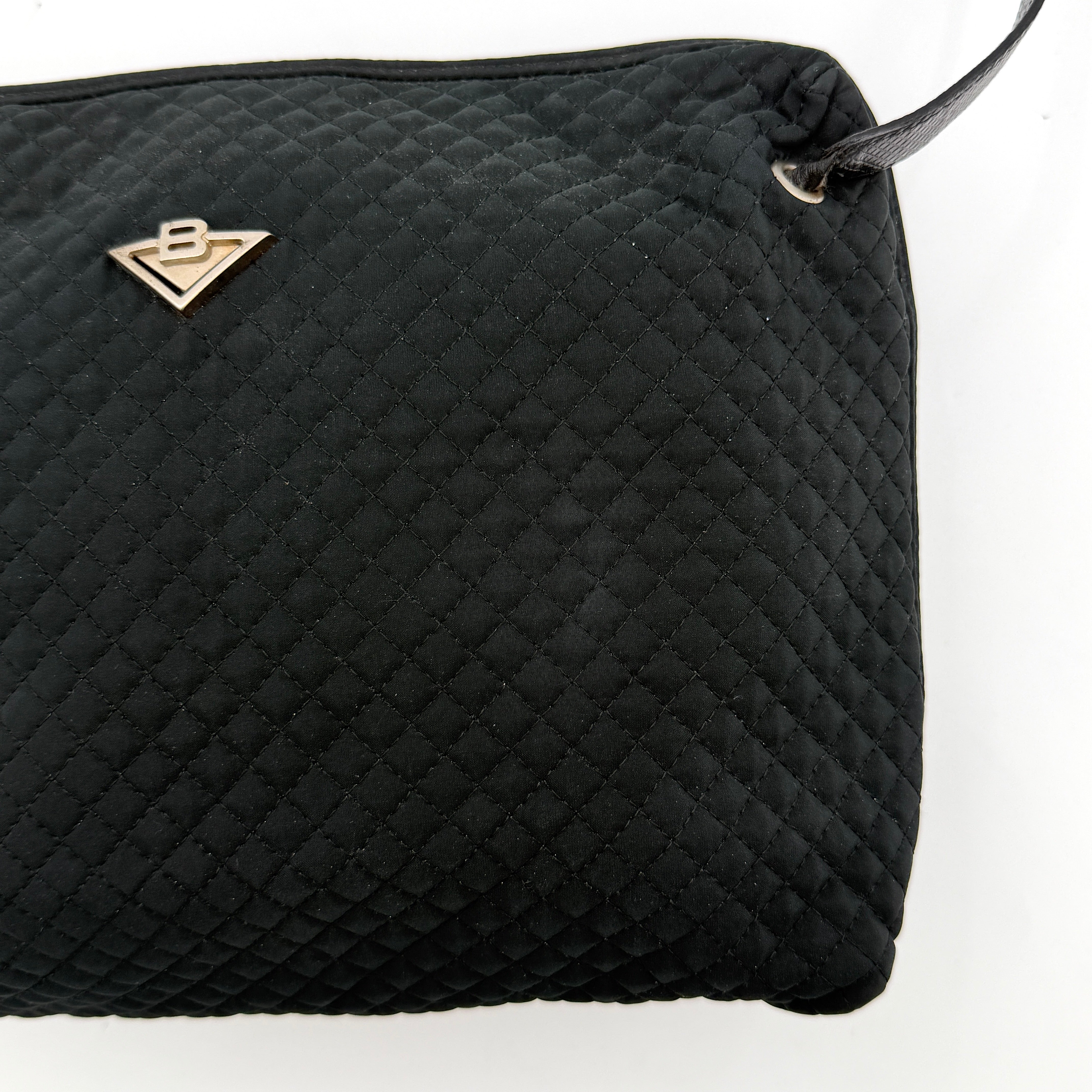 Bottega Veneta black quilted nylon crossbody bag with silver-tone logo hardware and leather strap.