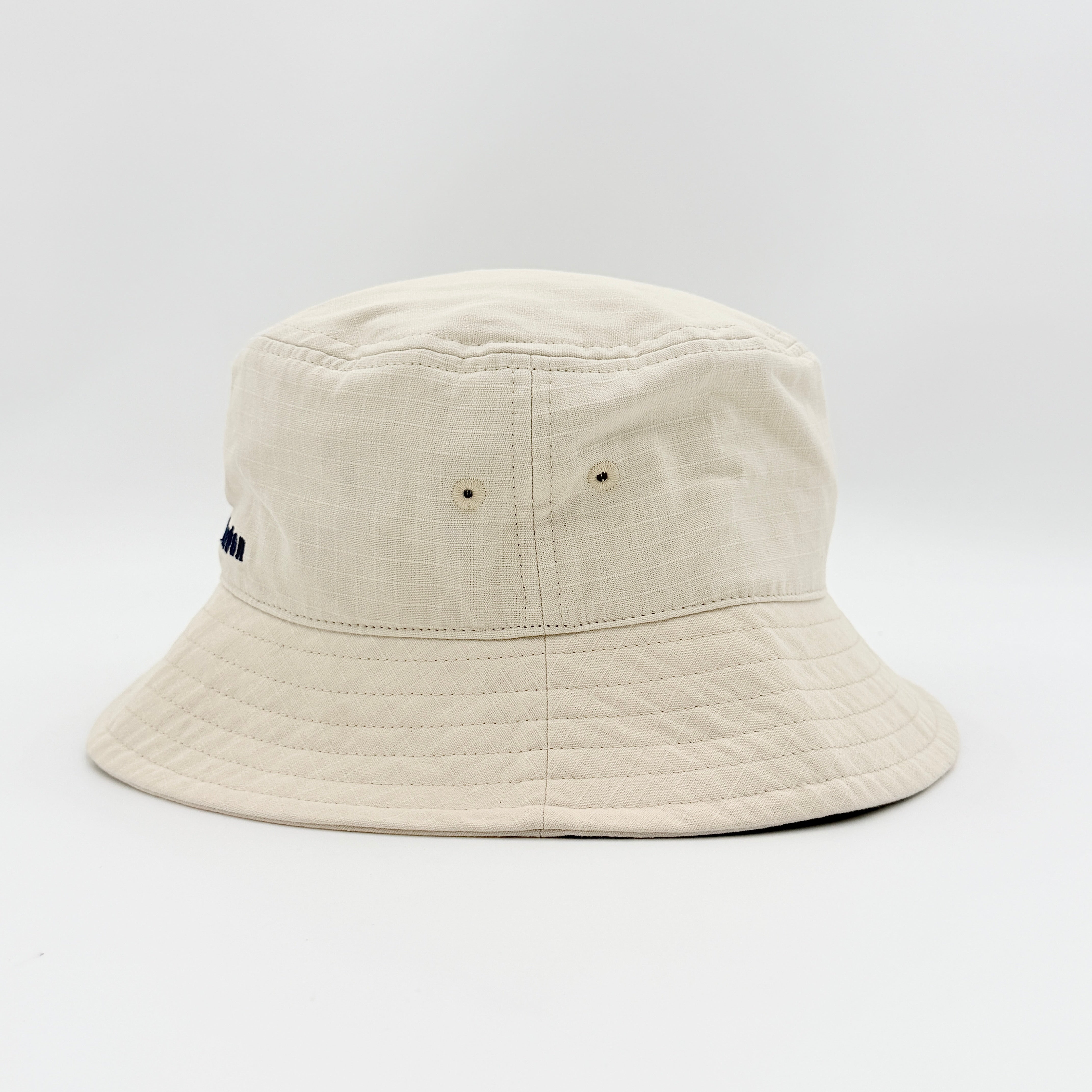 Vivienne Westwood Orb London bucket hat in cream cotton with black embroidery, shown from the front.