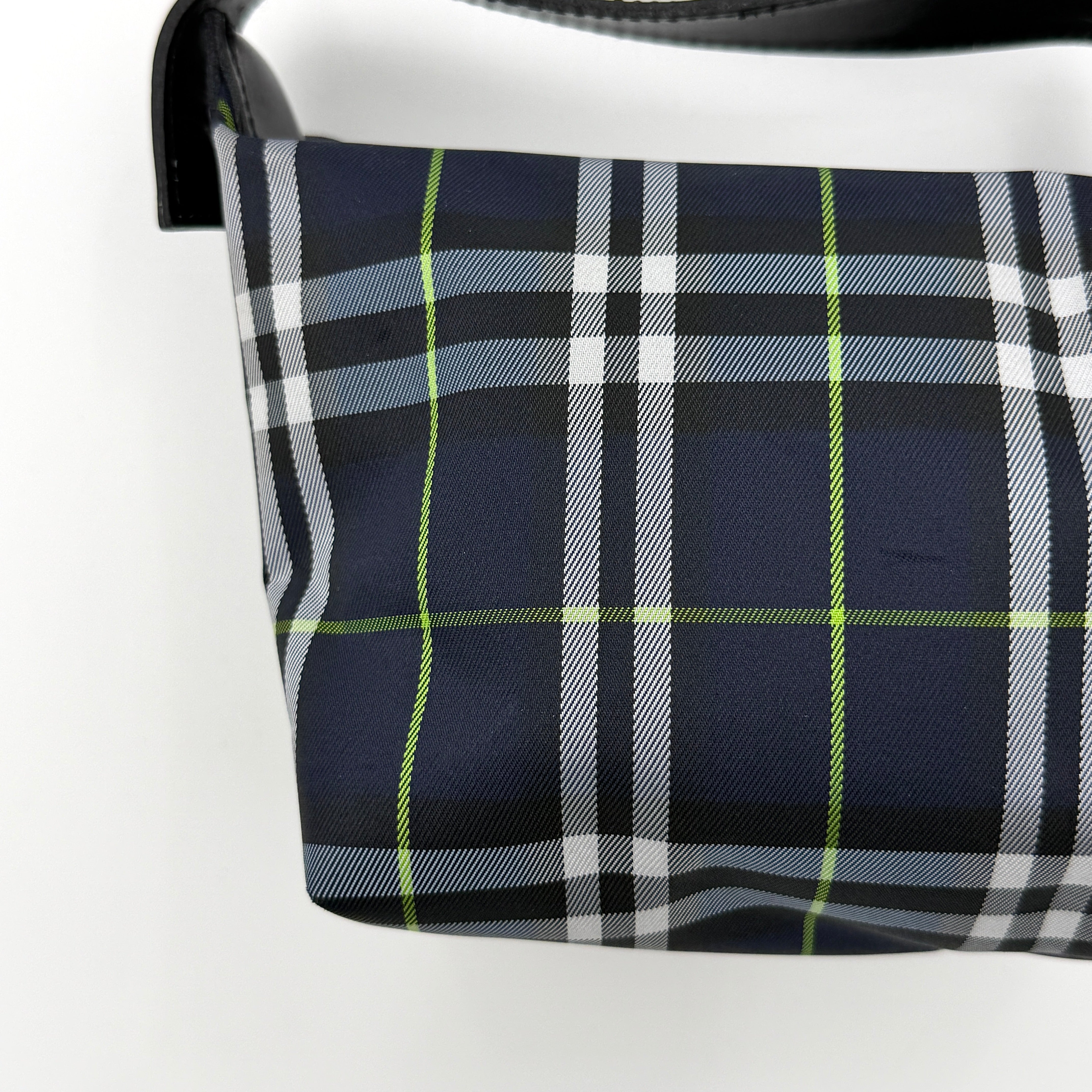 Burberry London mini handbag in navy Nova Check with black leather strap displayed against a clean white background.
