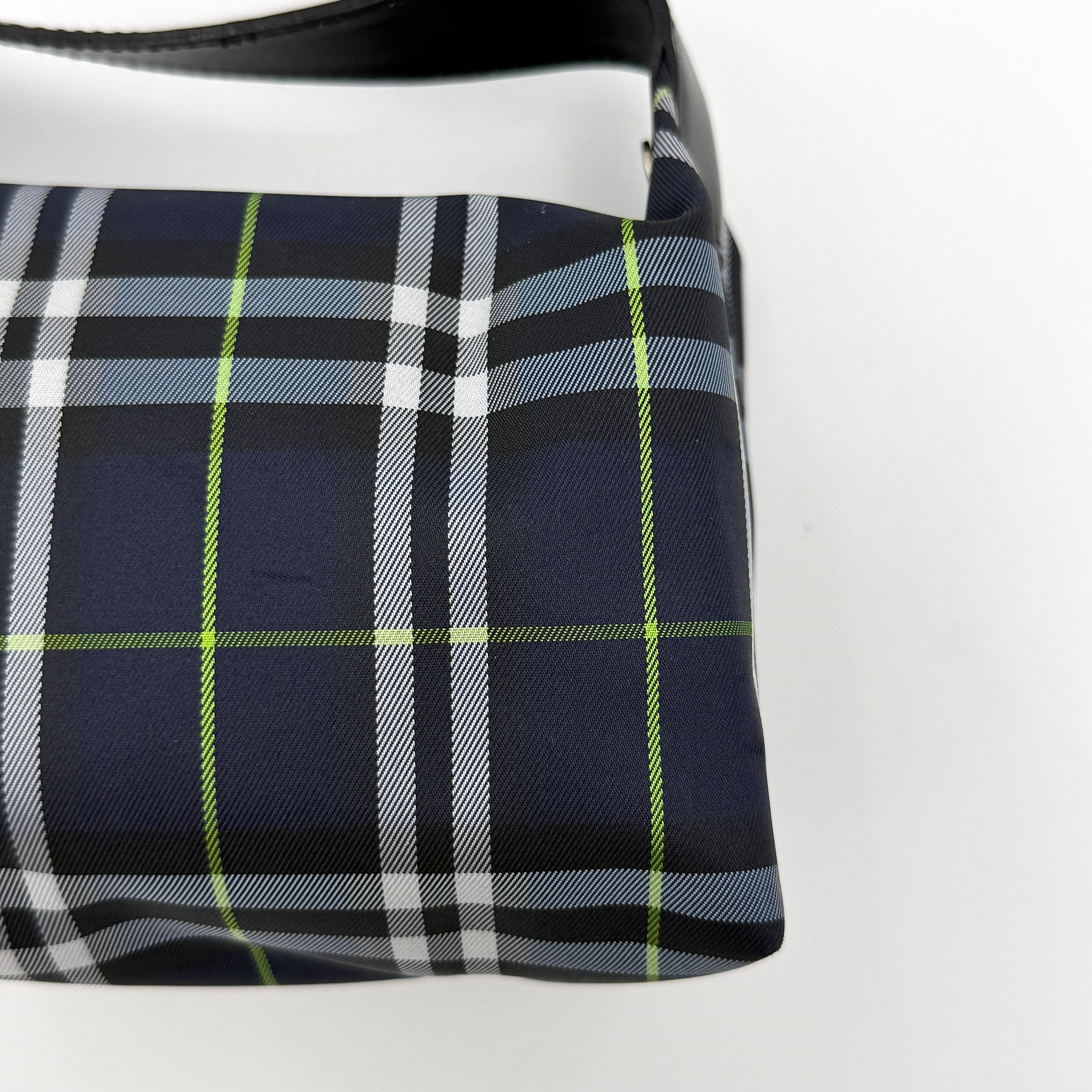 Burberry London mini handbag in navy Nova Check with black leather strap displayed against a clean white background.