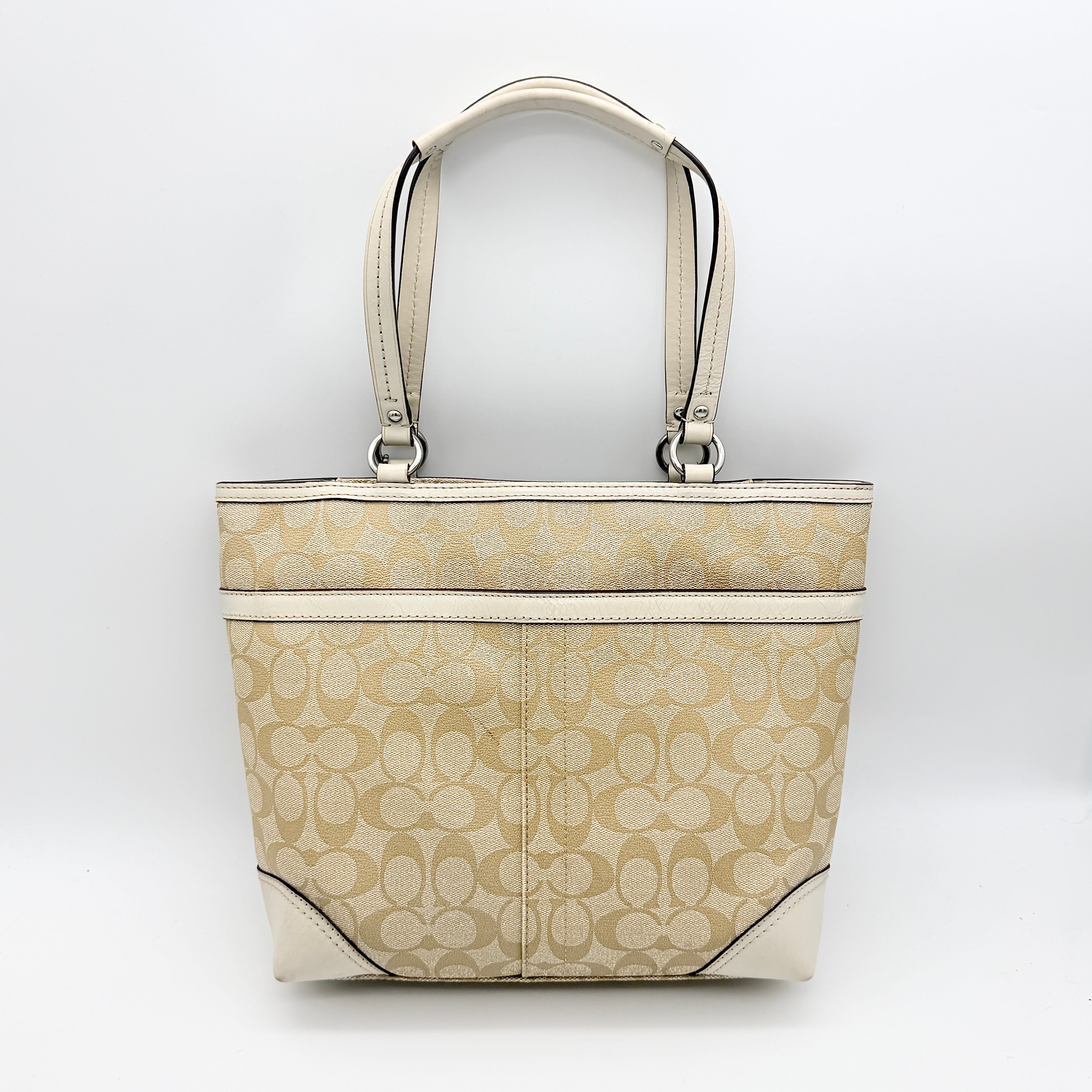Coach Signature Chelsea Heritage Stripe Tote in beige with pink and cream accents, finished with dual-colour hangtag and leather trim.