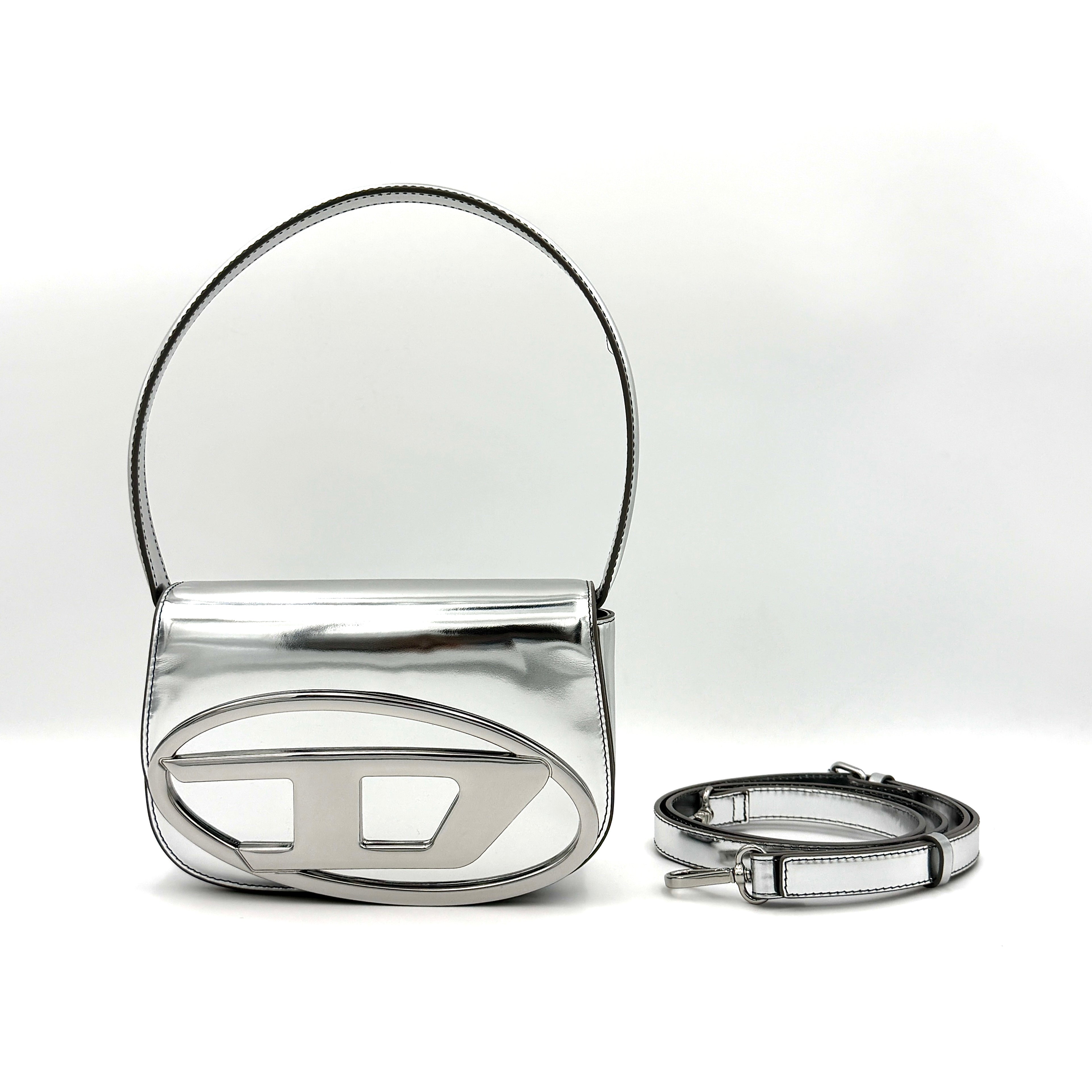 Diesel 1DR 2Way metallic silver shoulder bag with sculptural D logo and detachable strap displayed against a plain background.