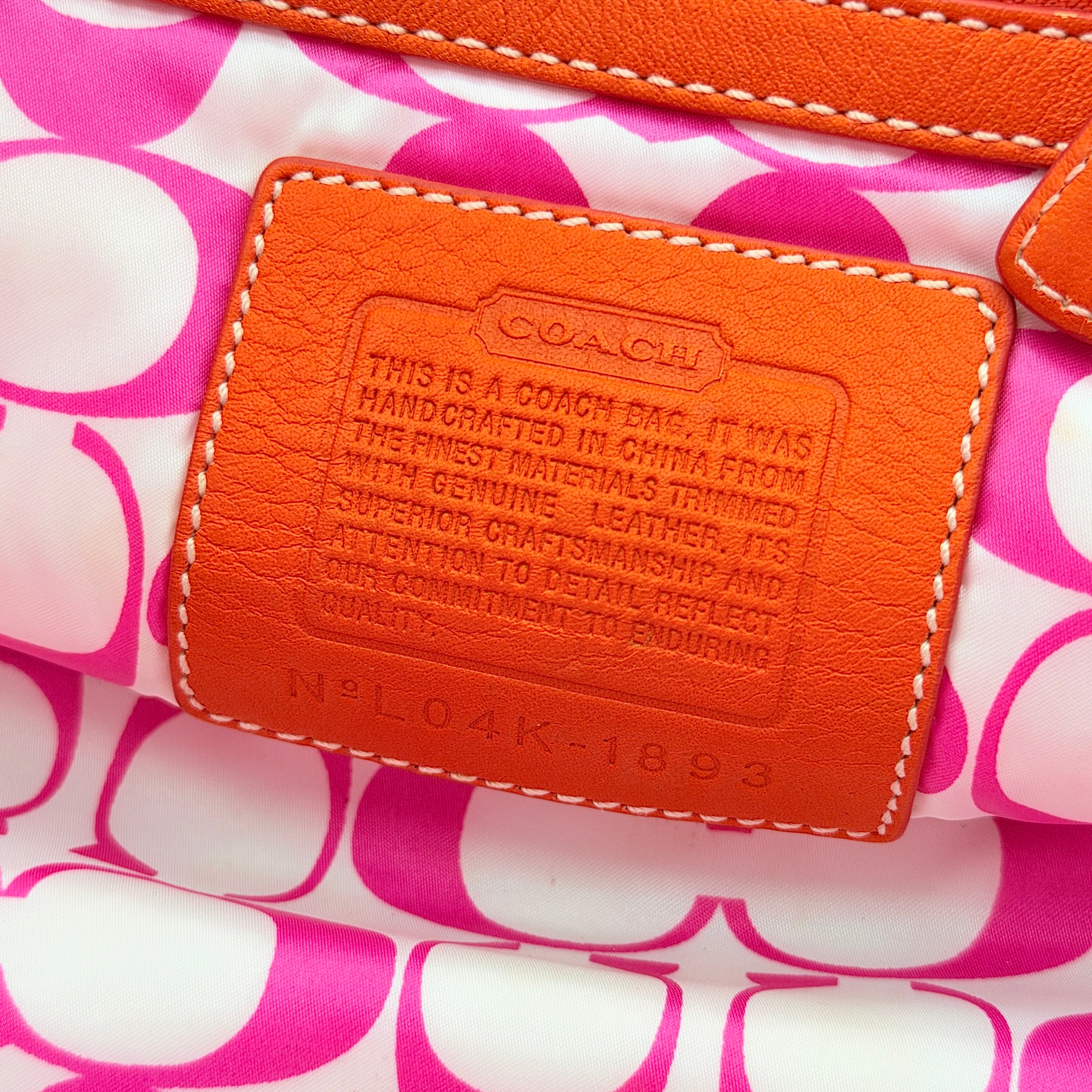 Coach Hampton Mini Tote Bag in hot pink nylon with canvas straps, leather trim, and ladybug charm.