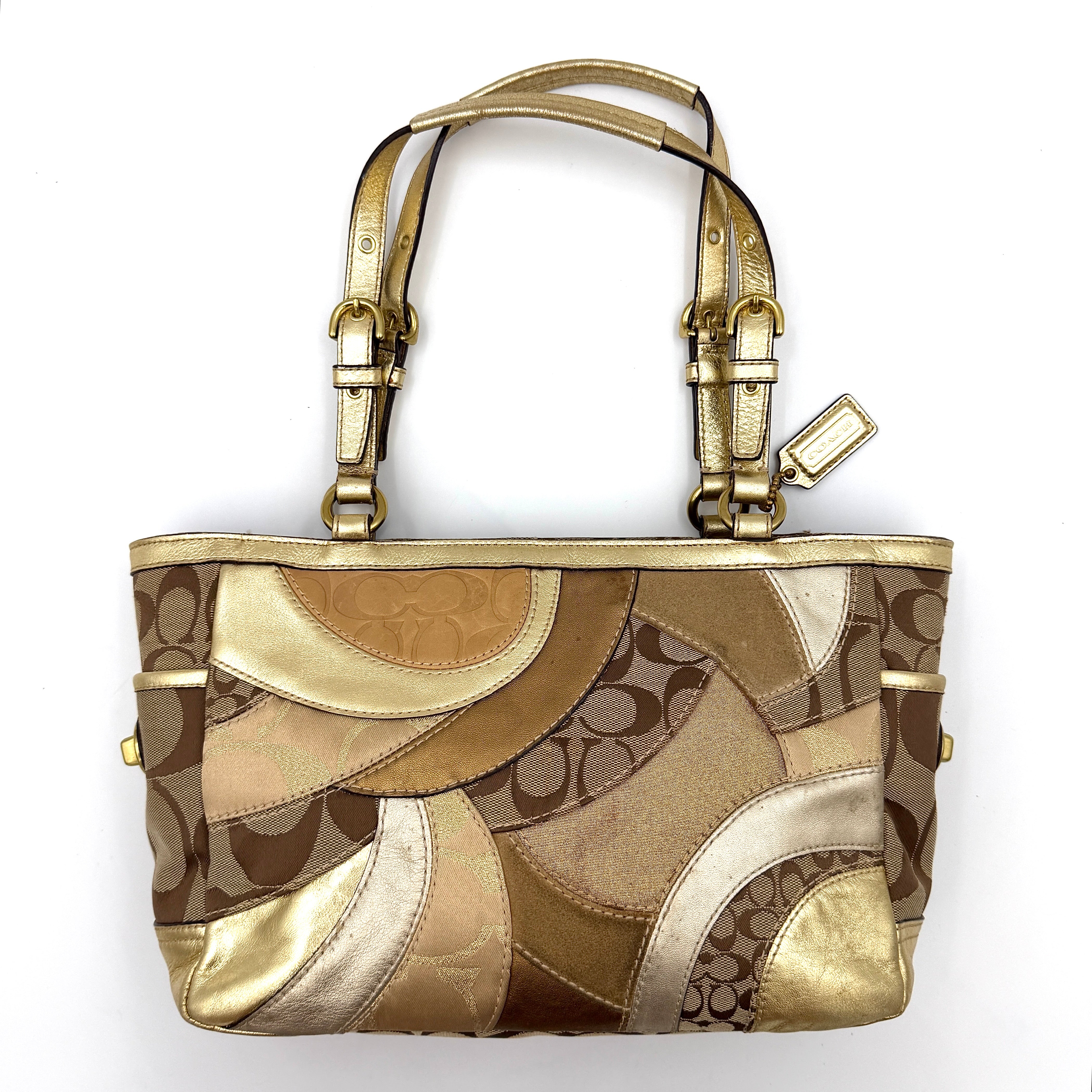 Coach Gallery Tote in a geometric patchwork of gold, beige, and tan with signature monogram and metallic leather against a white background.