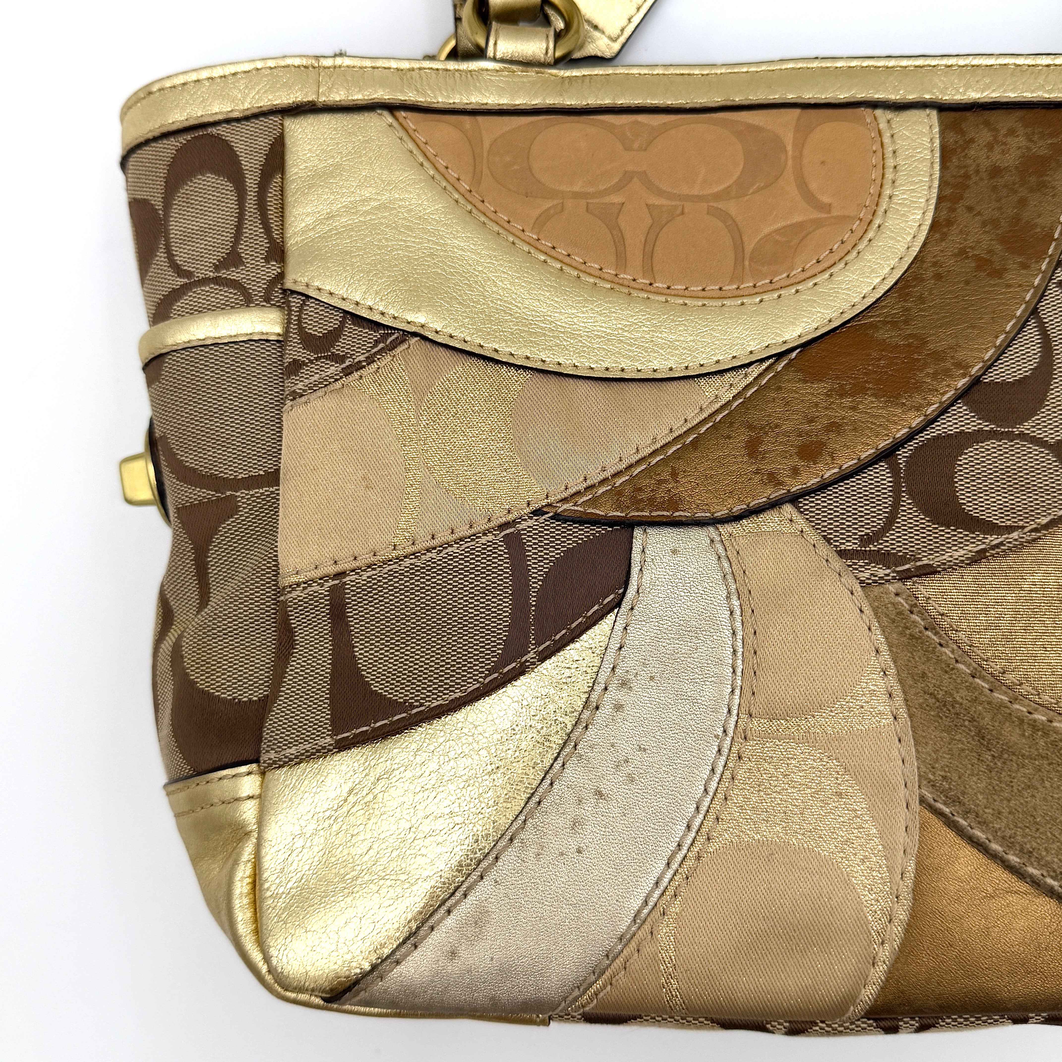 Coach Gallery Tote in a geometric patchwork of gold, beige, and tan with signature monogram and metallic leather against a white background.