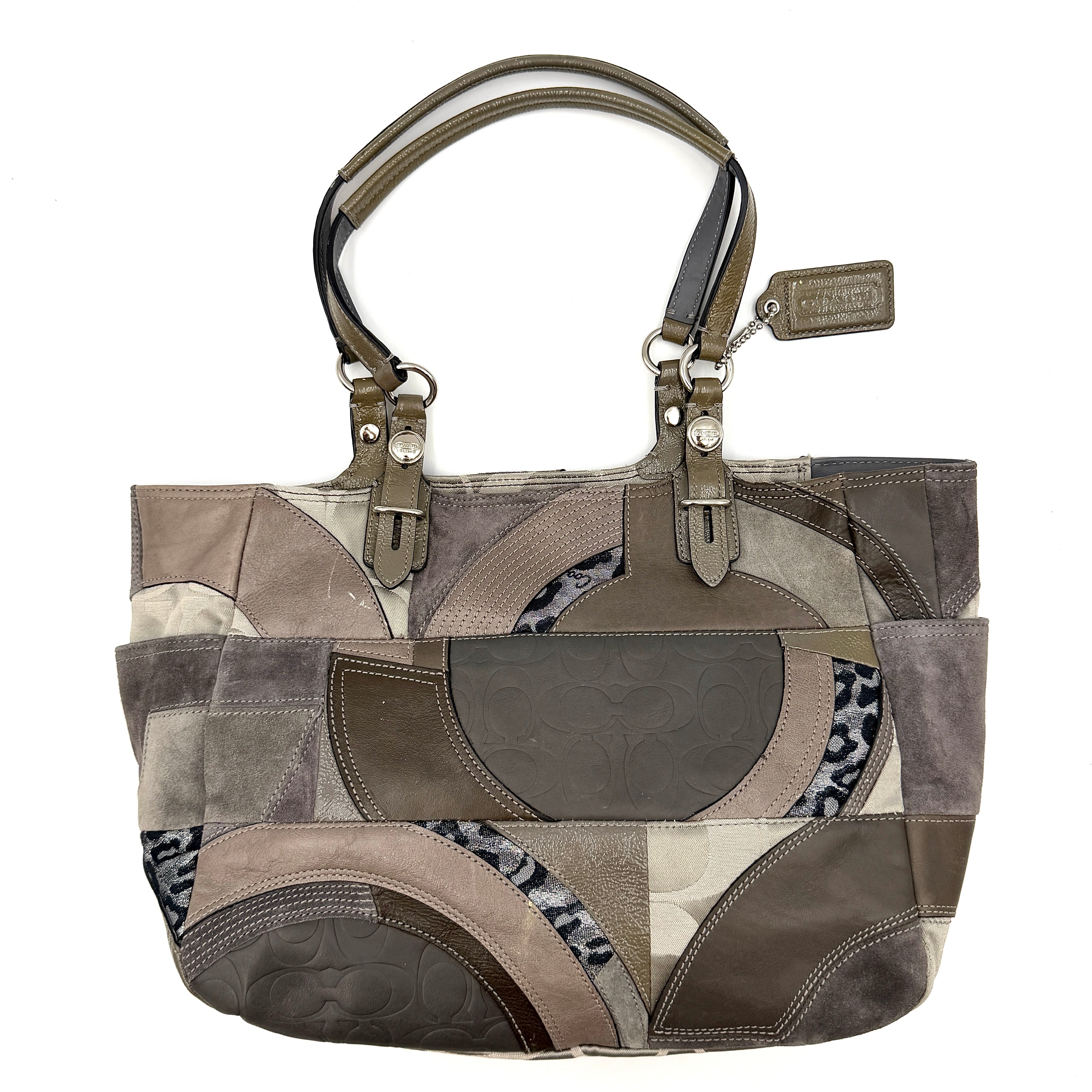 Coach Y2K patchwork tote in grey tones with jacquard, suede, and ocelot-print panels, shown with double handles and signature tag.