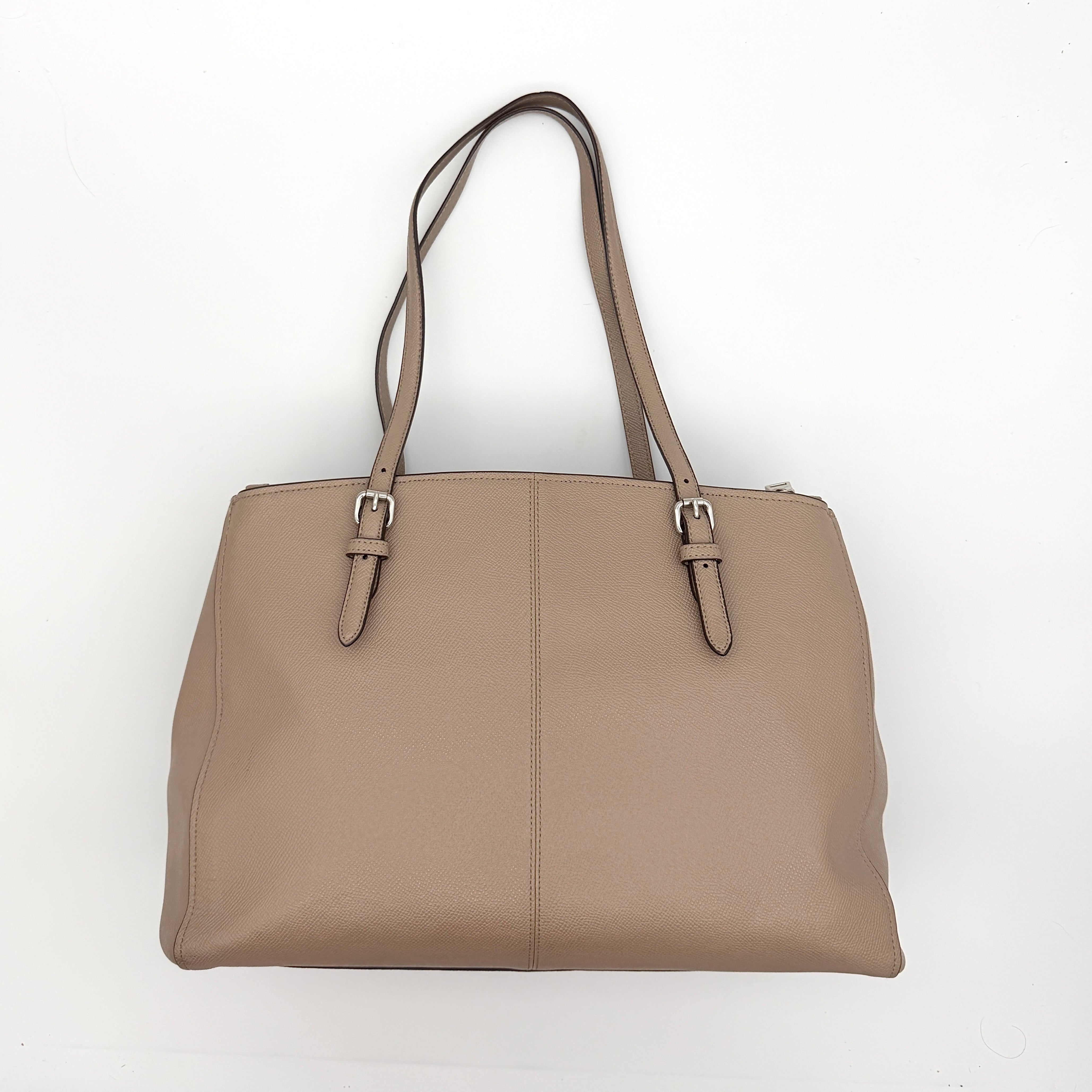 Coach Turnlock Carryall Shoulder Bag in light brown grained leather with silver hardware and double shoulder straps.