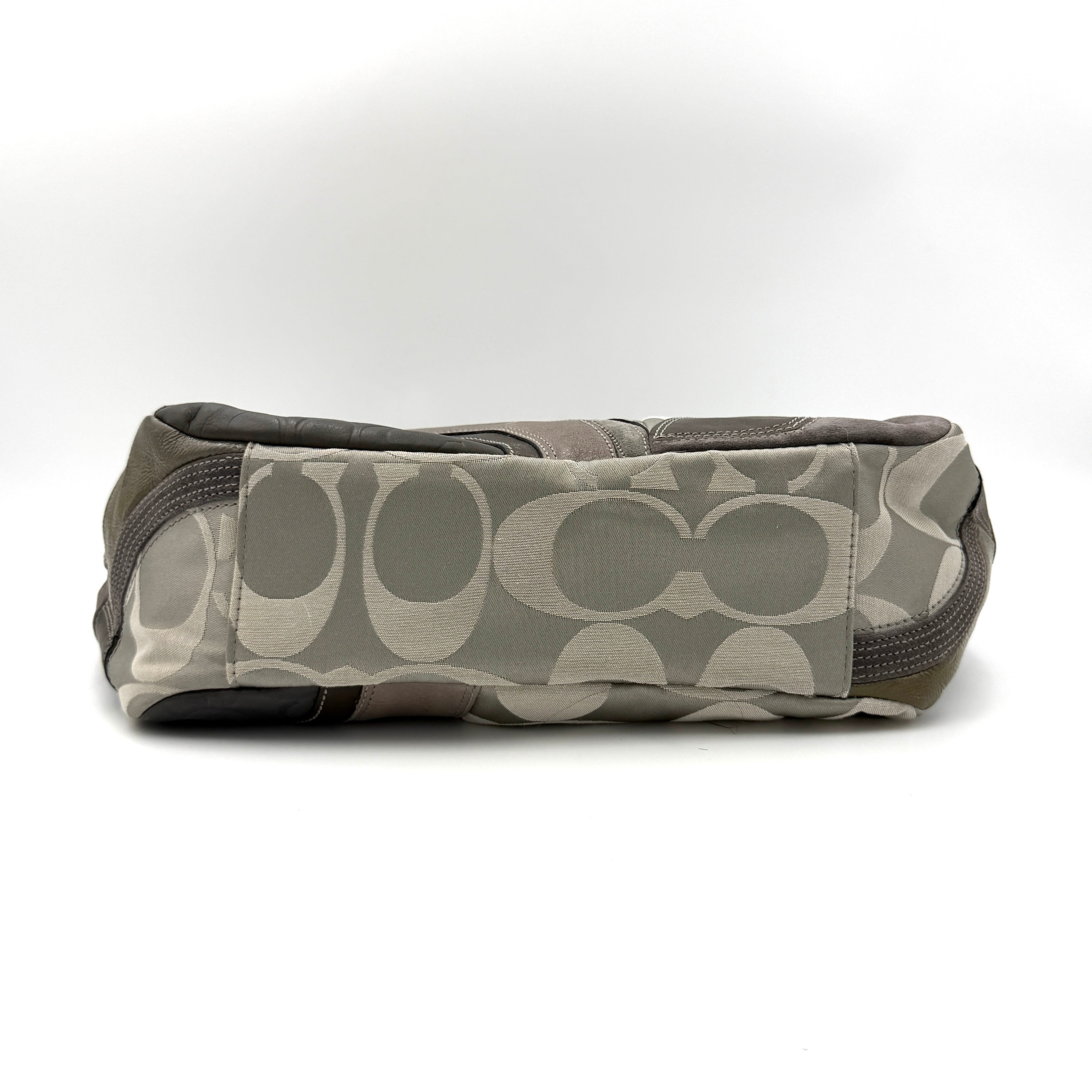 Coach Y2K patchwork tote in grey tones with jacquard, suede, and ocelot-print panels, shown with double handles and signature tag.