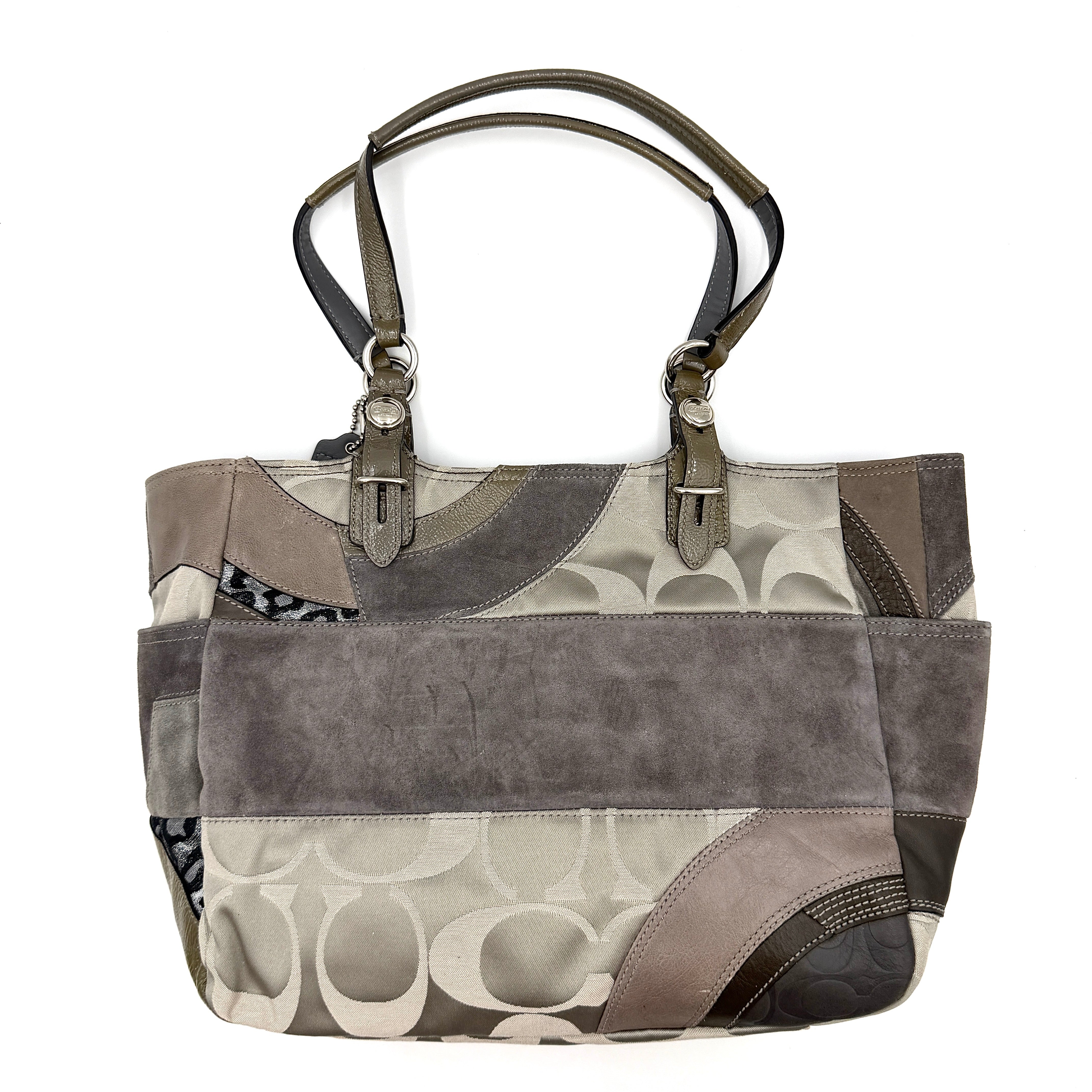Coach Y2K patchwork tote in grey tones with jacquard, suede, and ocelot-print panels, shown with double handles and signature tag.
