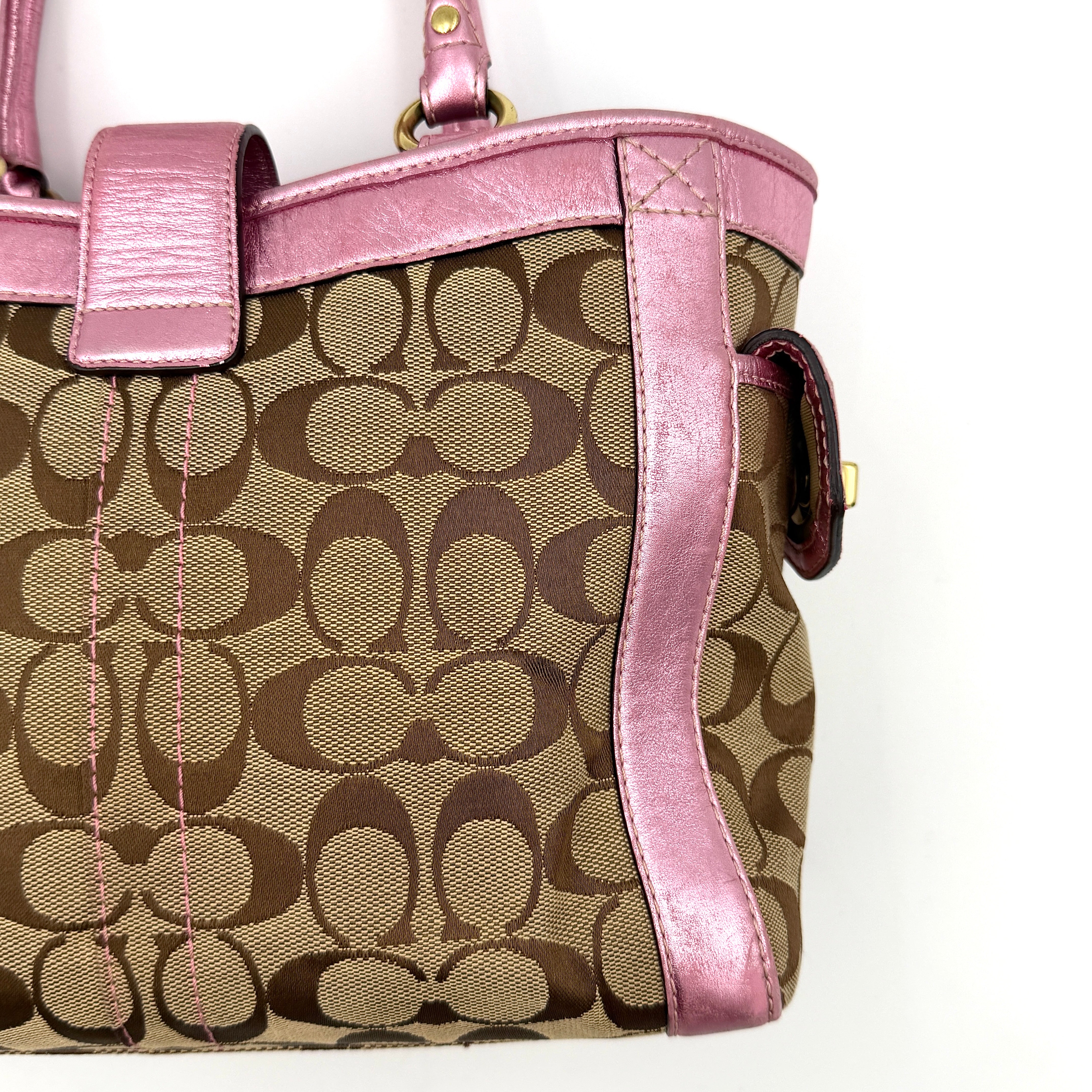 Coach Soho Buckle Tote featuring baby pink metallic leather trim and beige signature jacquard canvas with gold-tone hardware.