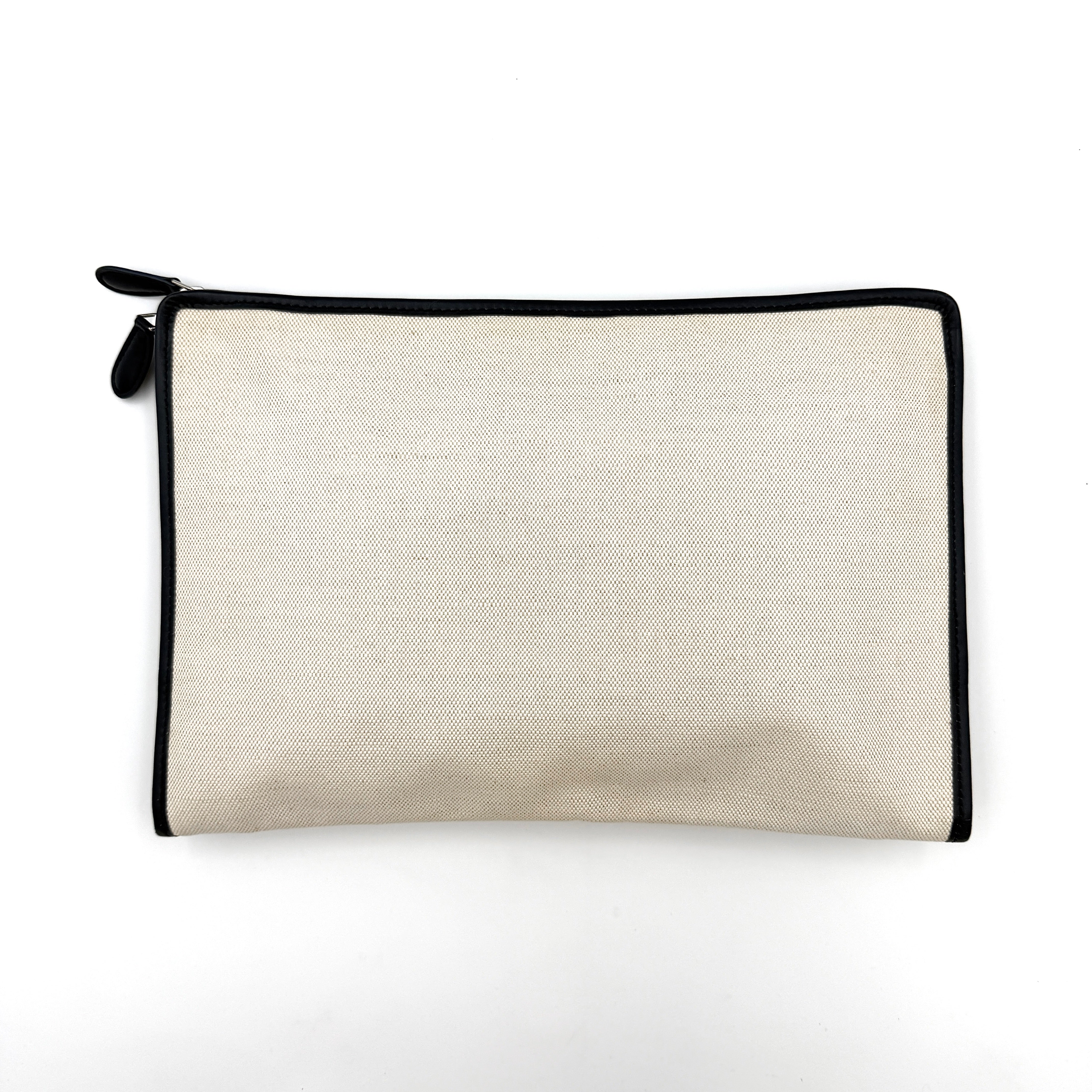 Balenciaga large ivory canvas clutch with black leather trim and logo, shown against a plain background.