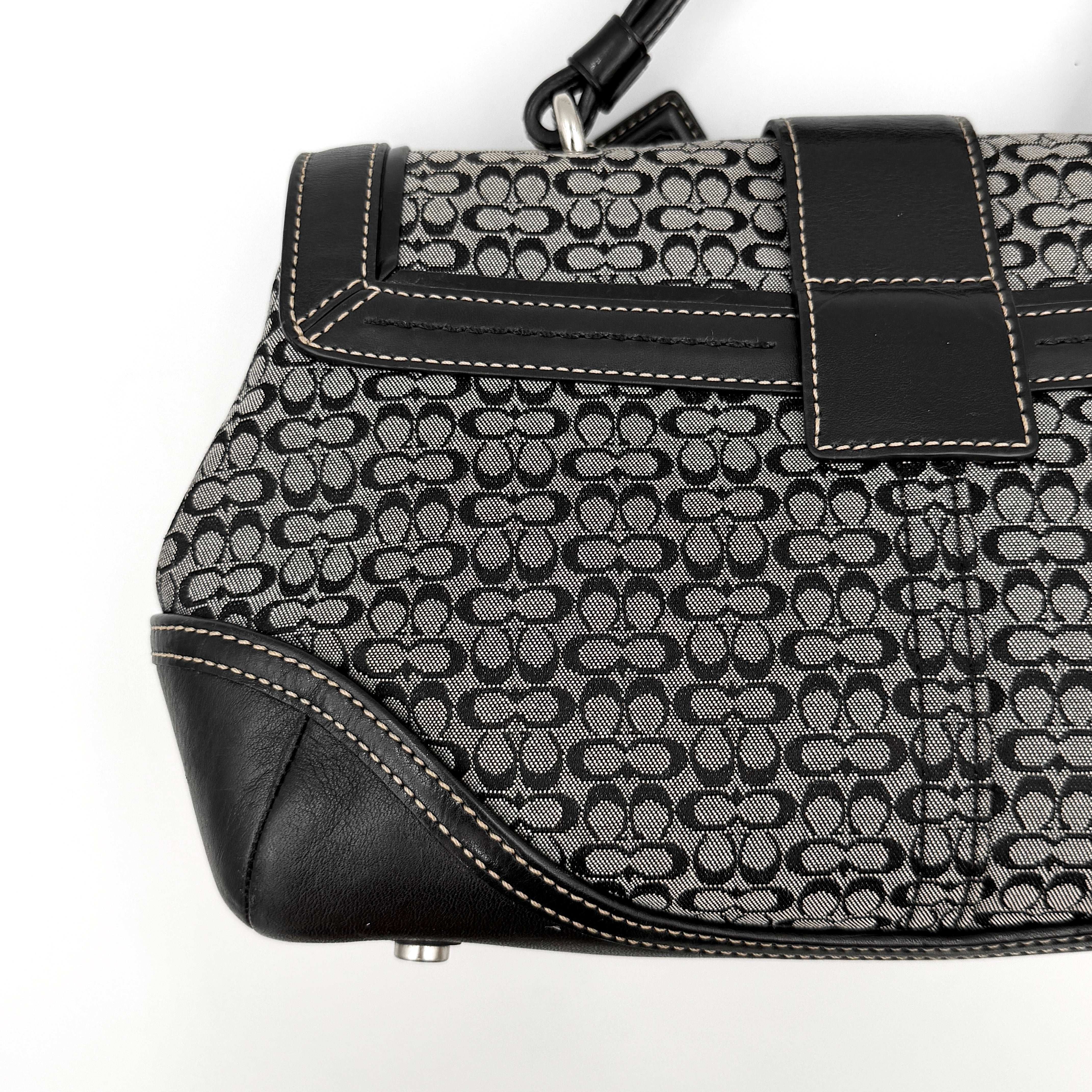 Coach Y2K Signature Soho Shoulder Bag in grey and black canvas with black leather trim and silver hardware, top handle style.