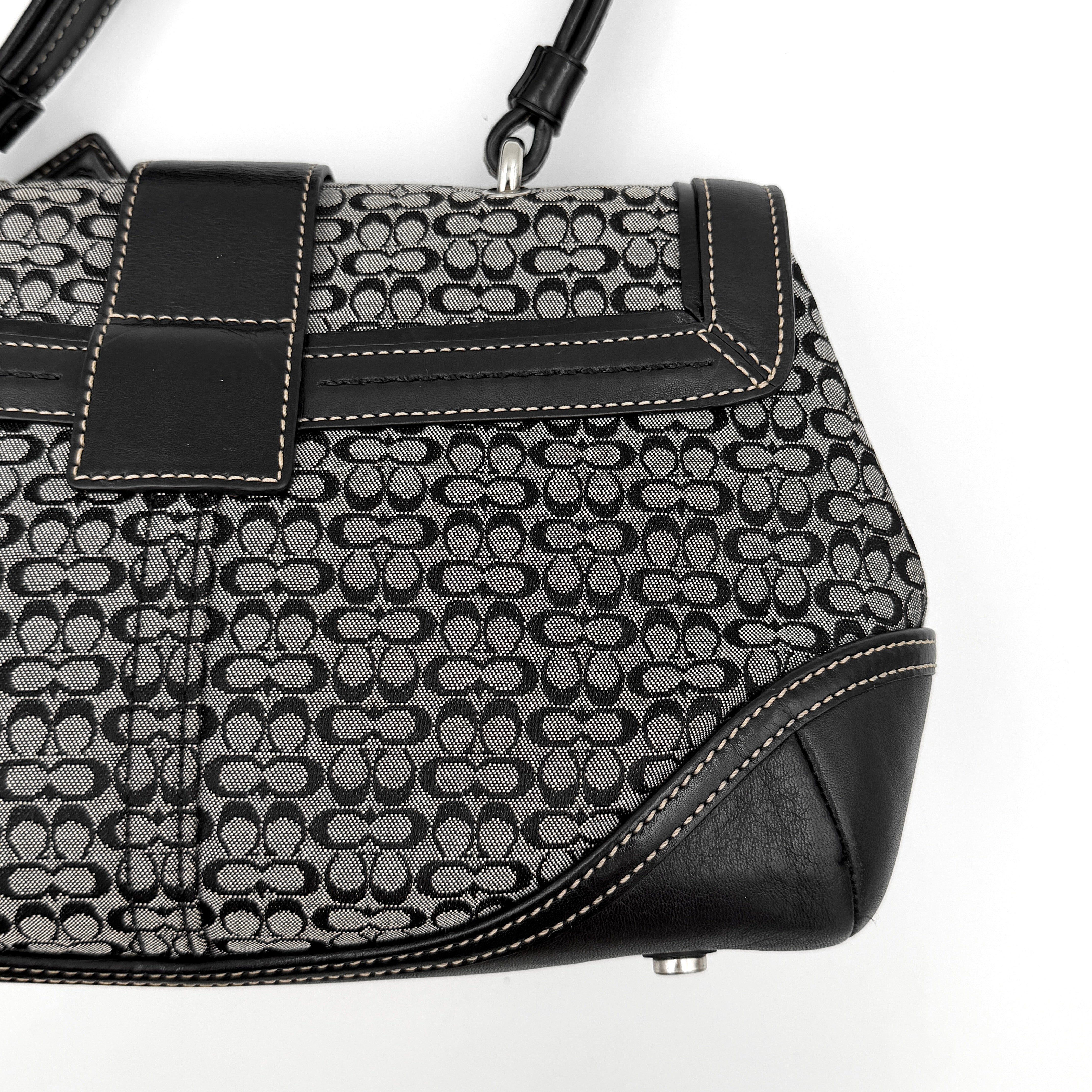 Coach Y2K Signature Soho Shoulder Bag in grey and black canvas with black leather trim and silver hardware, top handle style.