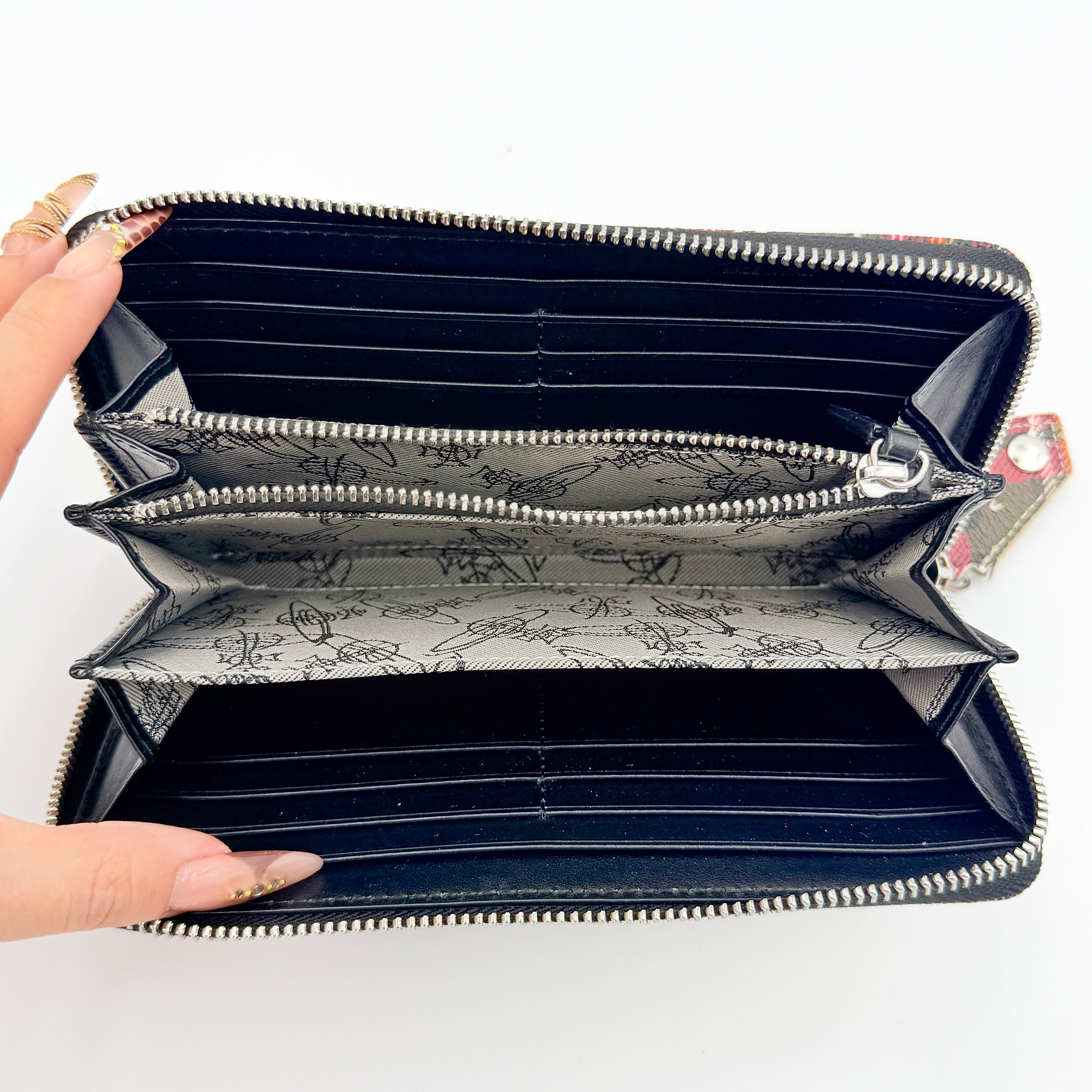 Vivienne Westwood Orb Paint Splash Tartan Wallet in multicolor tartan, featuring signature paint effect and silver Orb hardware.